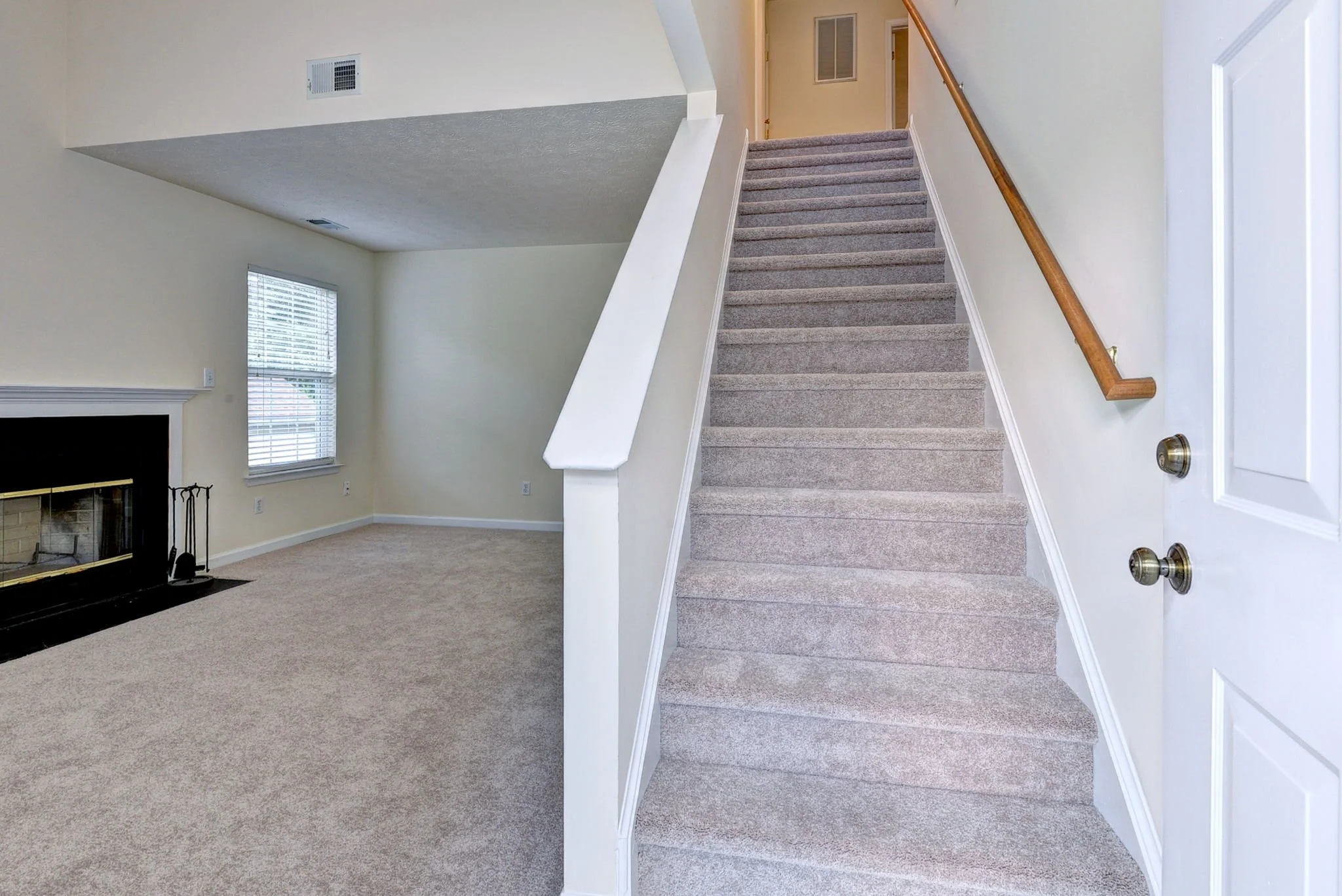 Entry Way to Living Room with Stairway to Second Floor