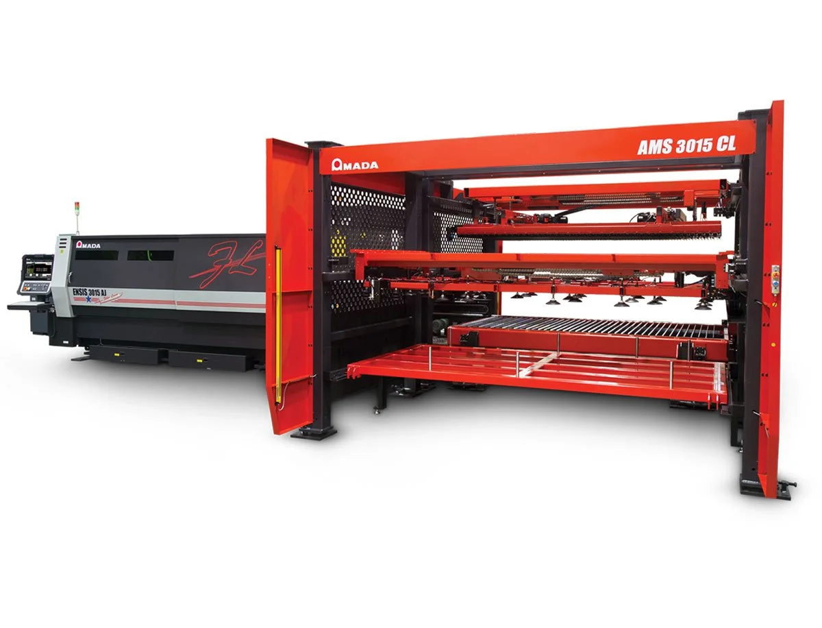 Amada laser cutting machine AMS 3015 CL, featuring a red and black design with multiple shelves and control panel.