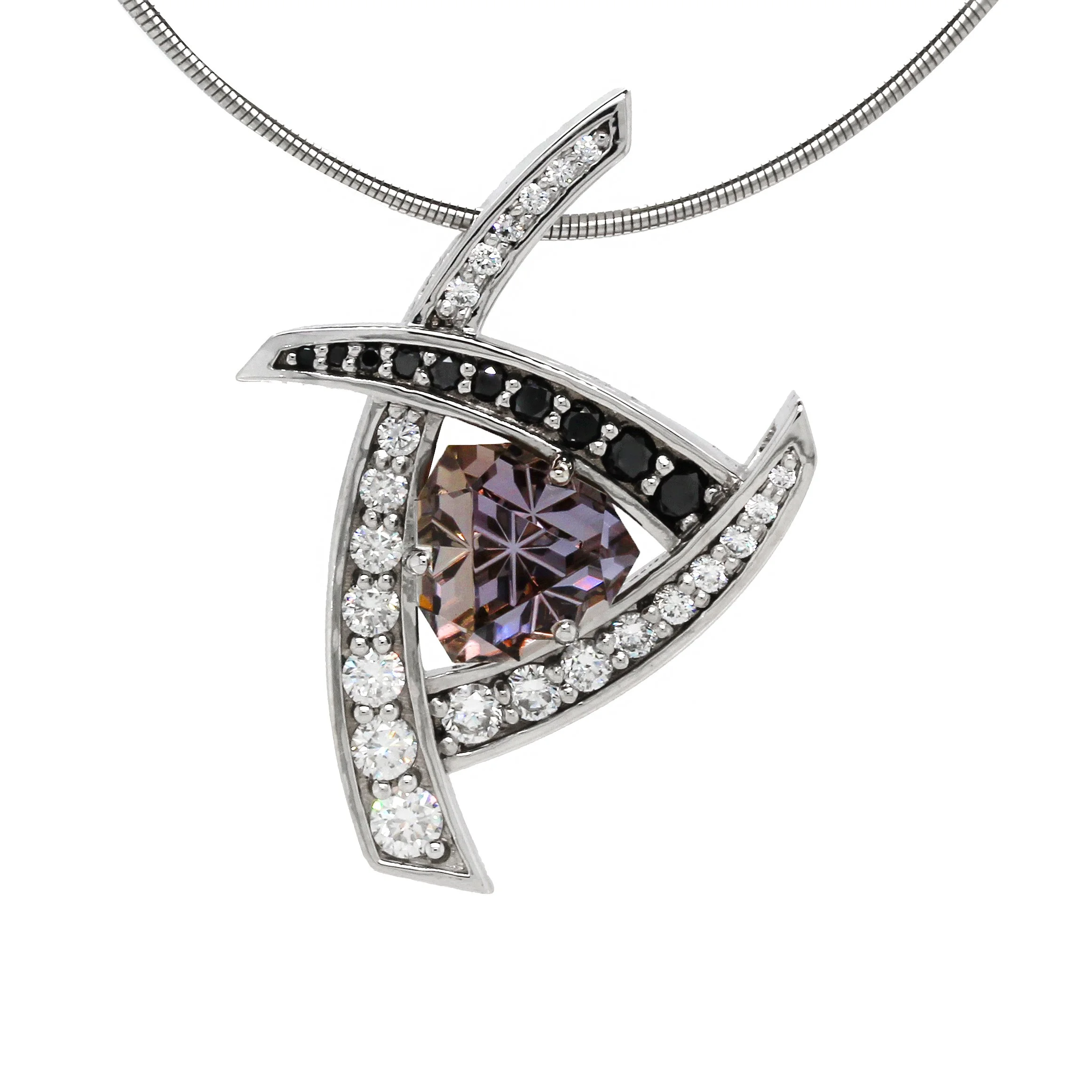Close-up of a decorative silver pendant necklace with a large purple gemstone in the center, surrounded by clear and black smaller stones, against a white background.