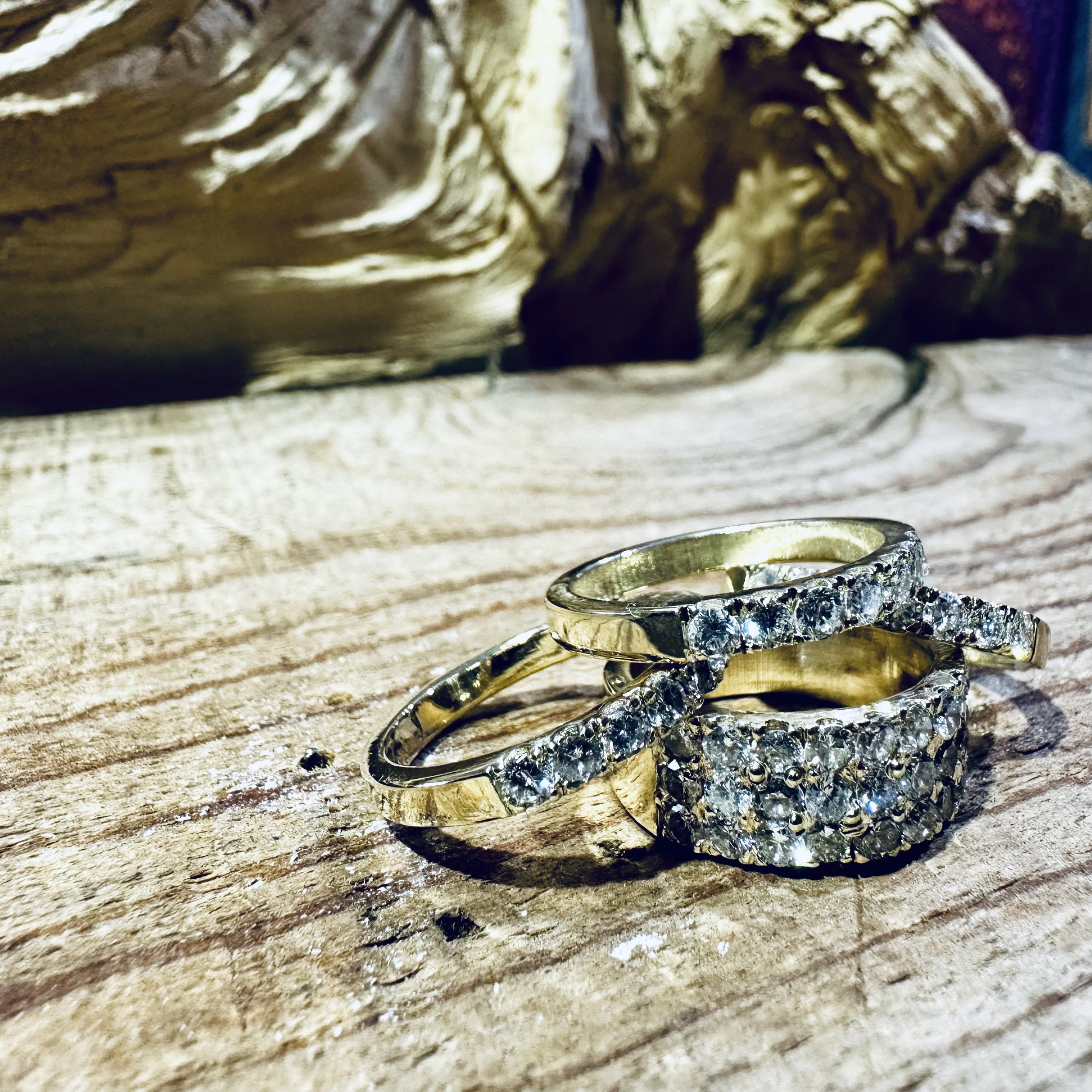 Matching set of rings for mother and daughters repurposing family heirloom diamonds.