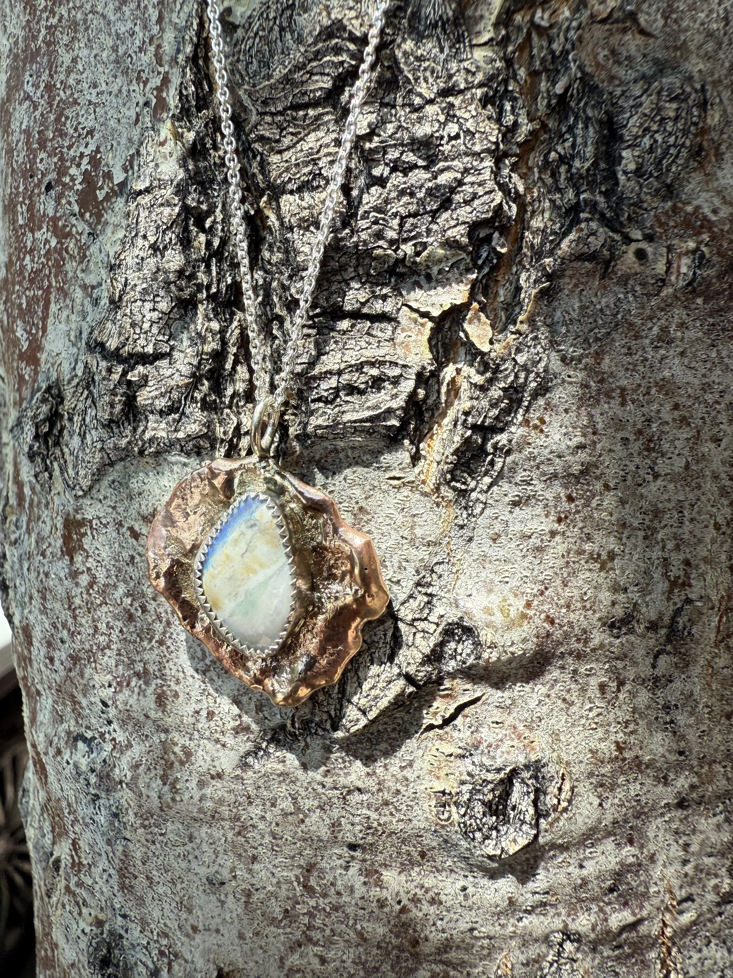 Hand crafted and torch textured gold filled and sterling silver pendant including all natural Australian boulder opal.