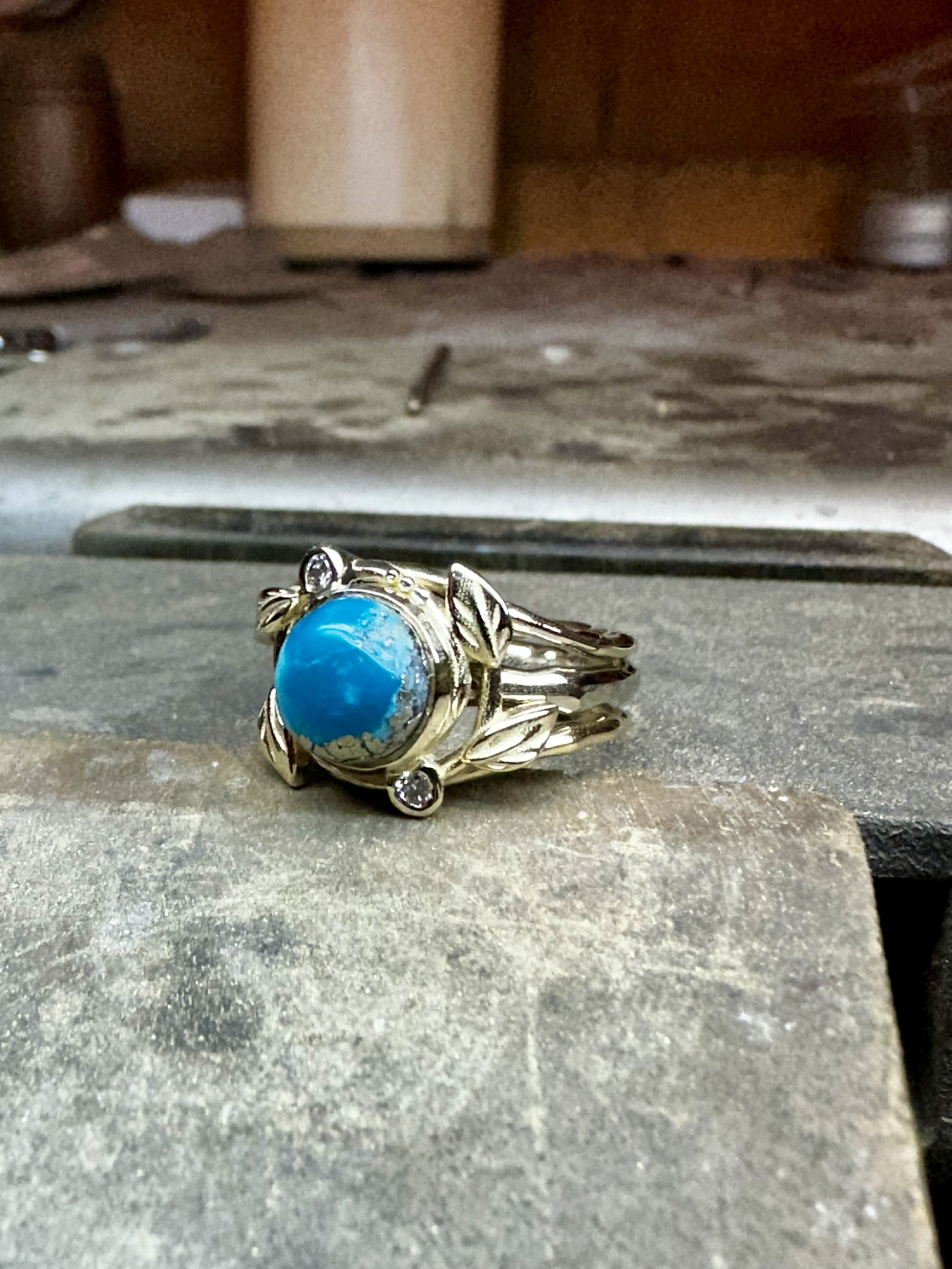 Custom redesigned wedding ring including natural turquoise, diamonds and 14 karat gold.