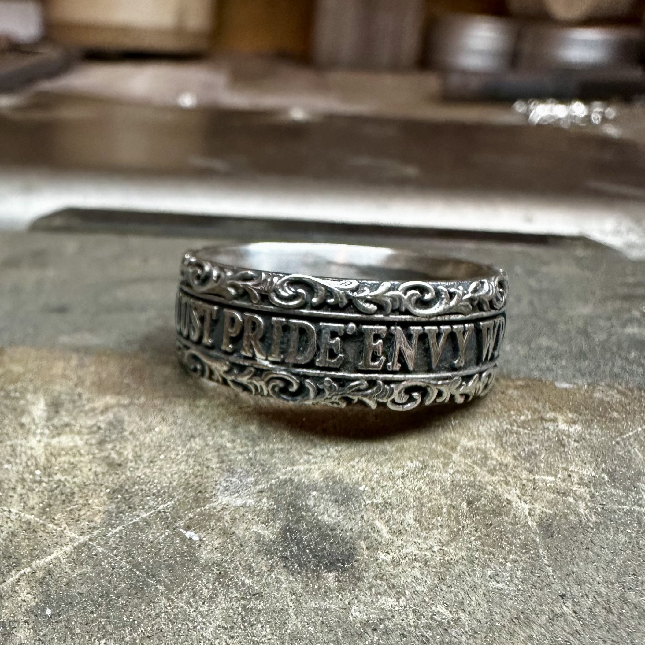 Custom 7 deadly sins ring in repurposed sterling silver.