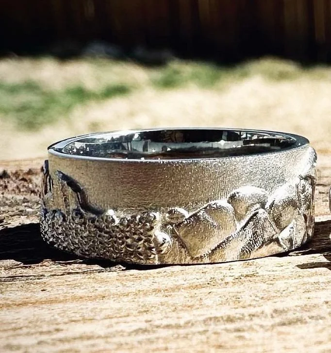 Handmade 14 karat white gold wedding band including mountains and rock formations from around the United States