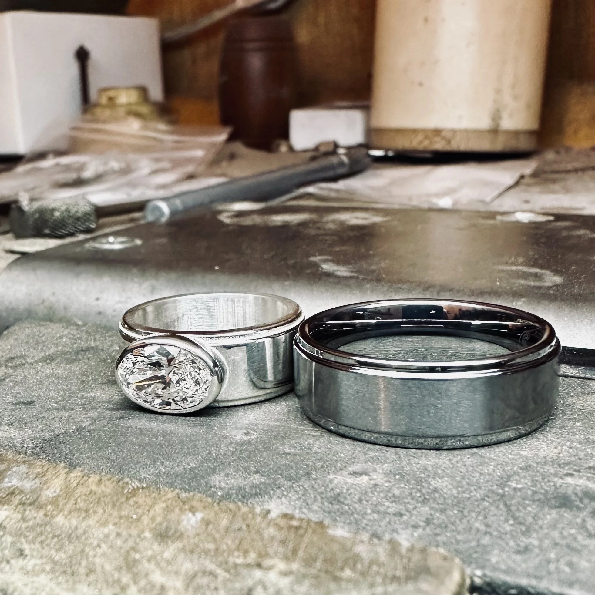 Custom ladies wedding ring to match groom's tungsten wedding band. Ring crafted in 14 karat white gold and diamond.
