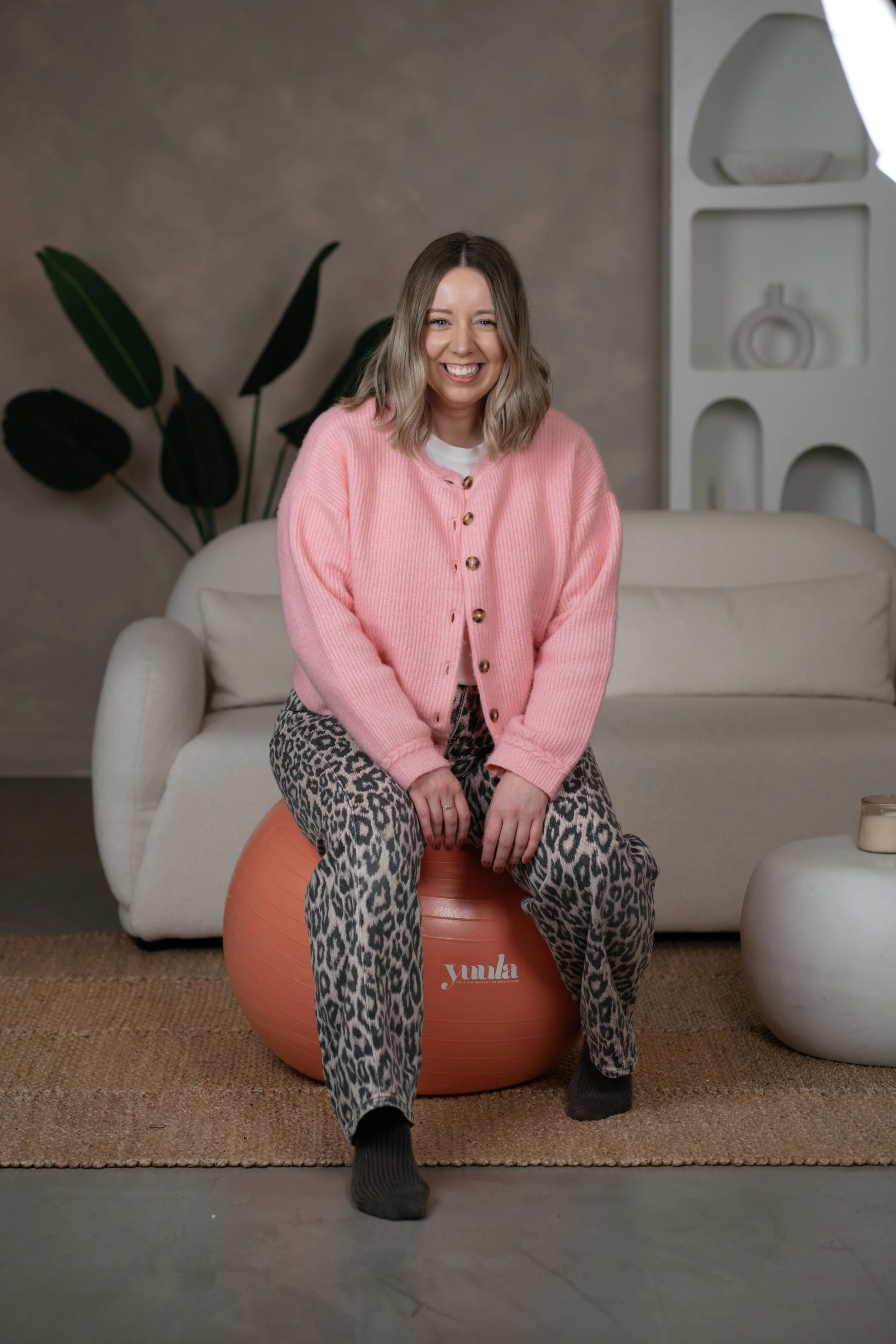 A hypnobirthing teacher using a birth ball in Tynemouth, north tyneside