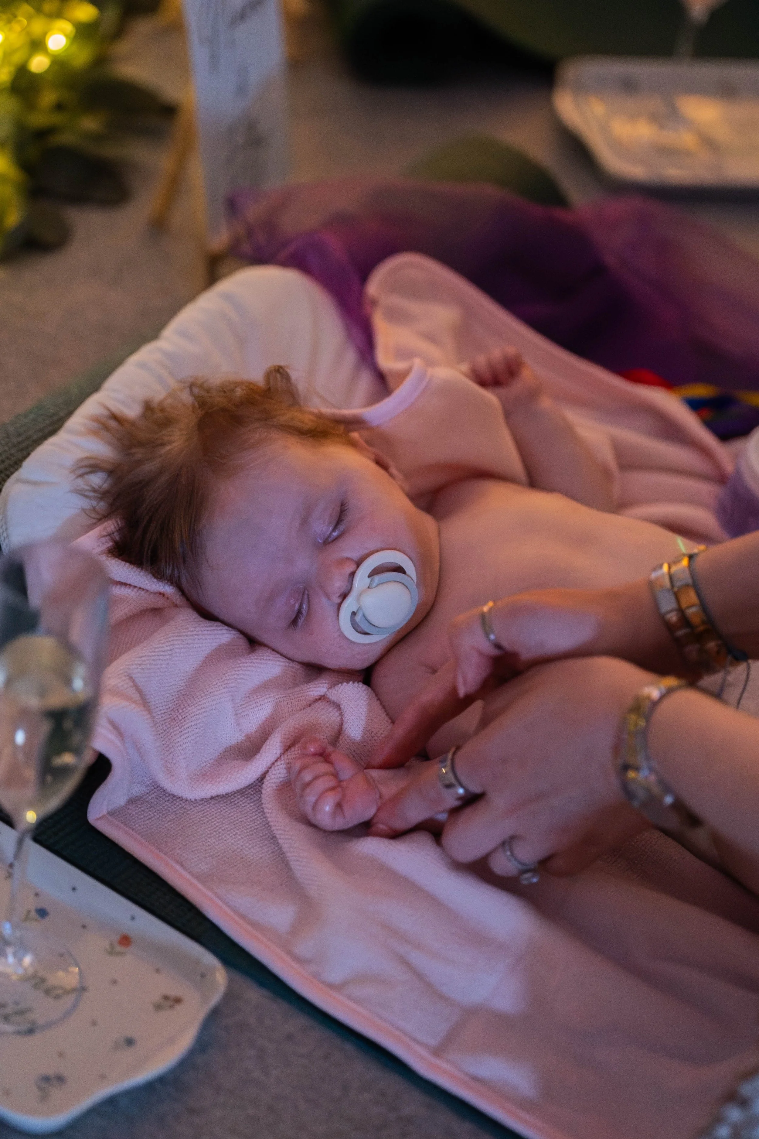 a baby asleep in a baby massage class in Tynemouth