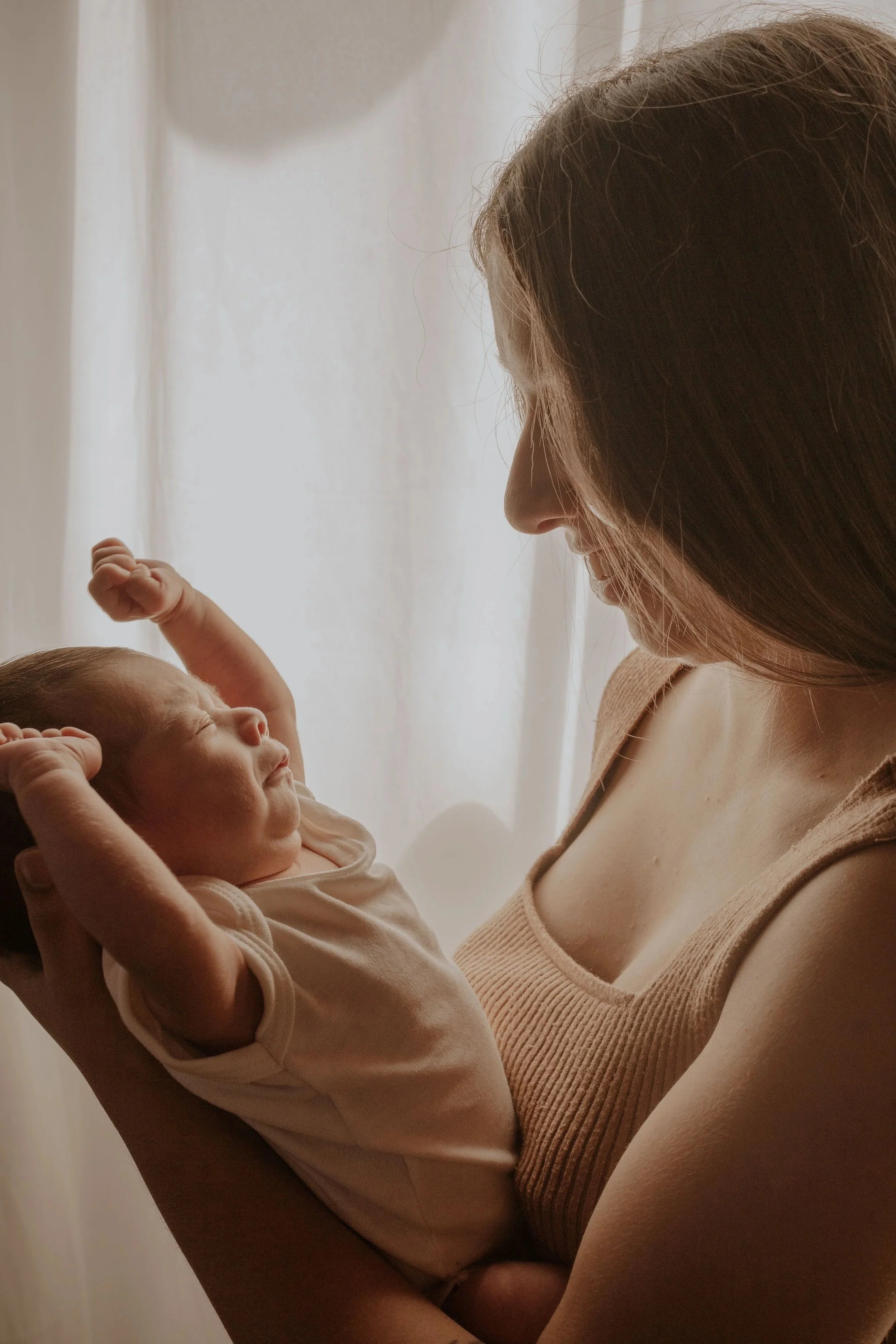 A hypnobirthing mum with her baby after doing an online hypnobirthing course