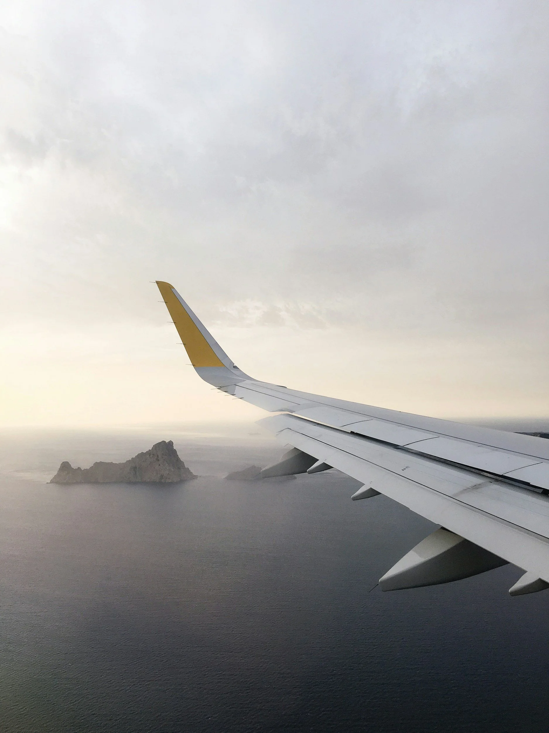 View from a private jet looking out at the wing.