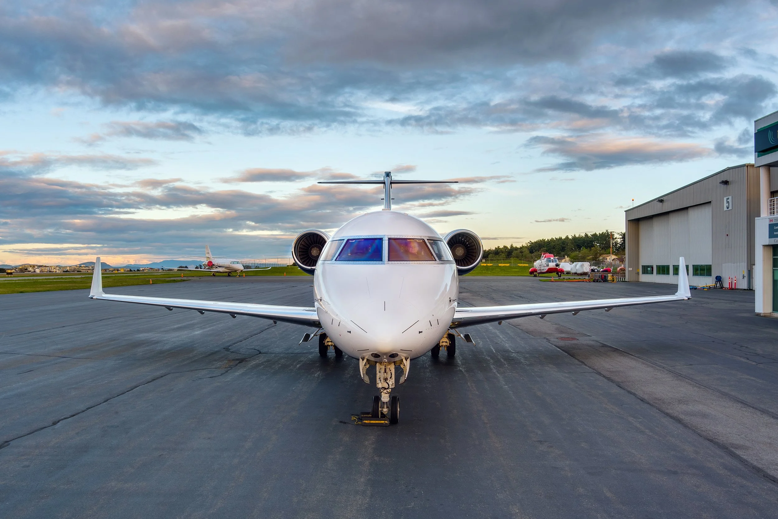 Front view of a small private jet parked on the tarmac at VIH Execujet's FBO.