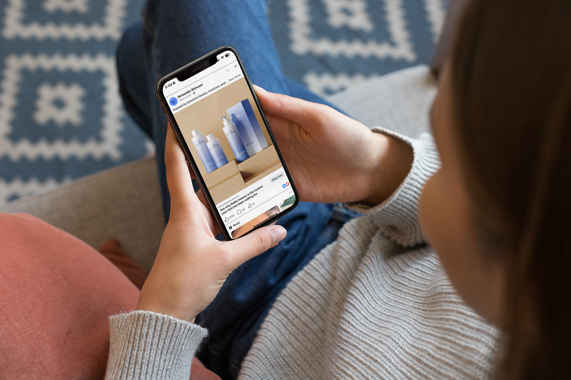 mockup-of-a-girl-sitting-on-a-couch-using-her-iphone-xs-25355.png