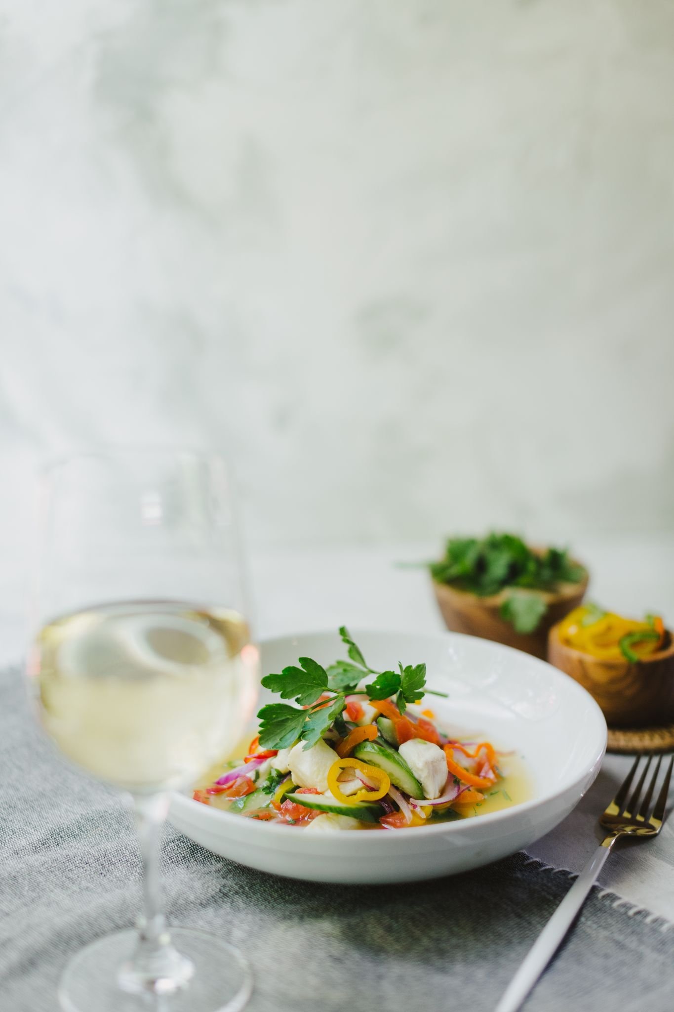 tuna ceviche with white wine on a bright, light background