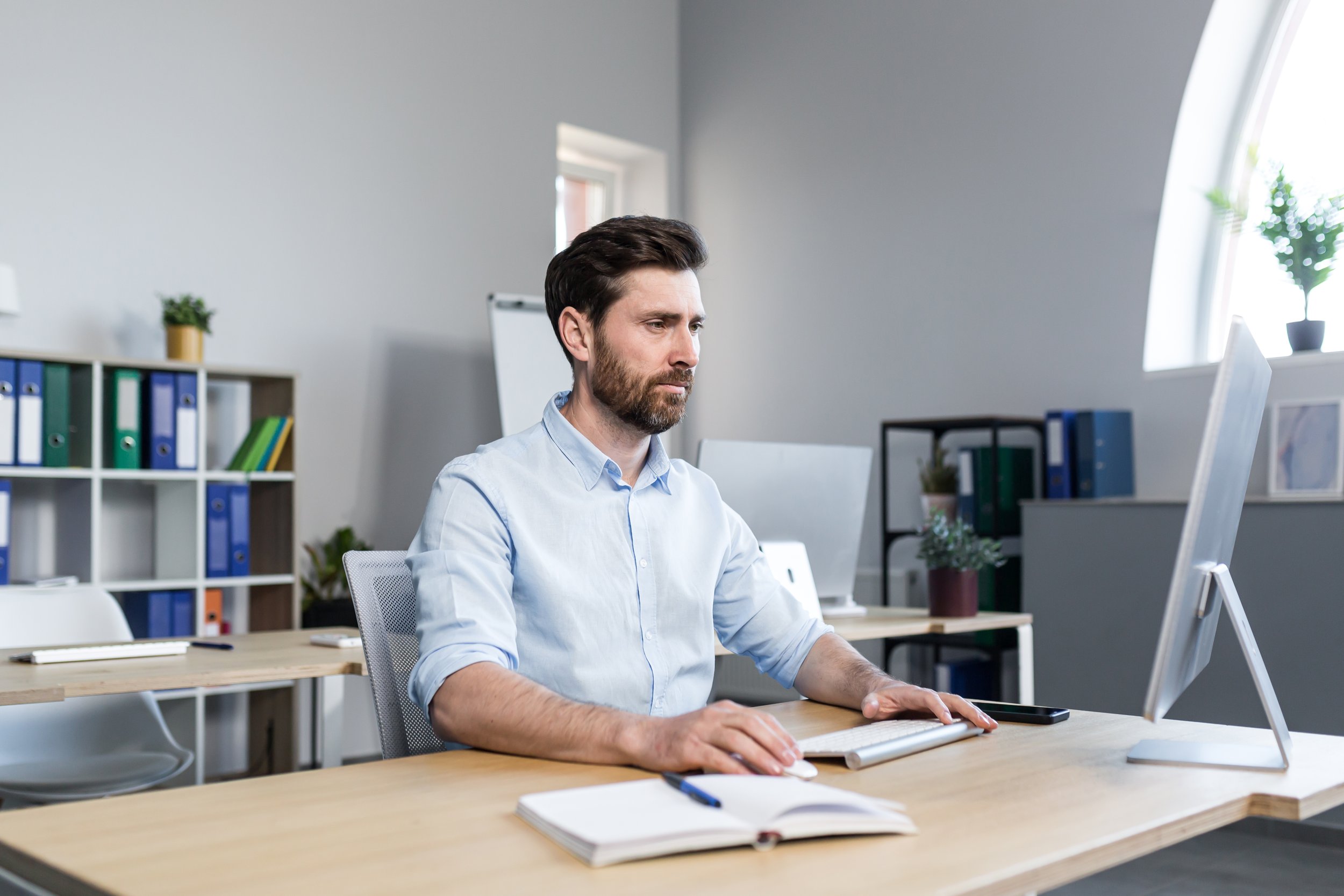 serious-businessman-working-in-the-office-at-the-c-2023-11-27-04-57-58-utc.jpg