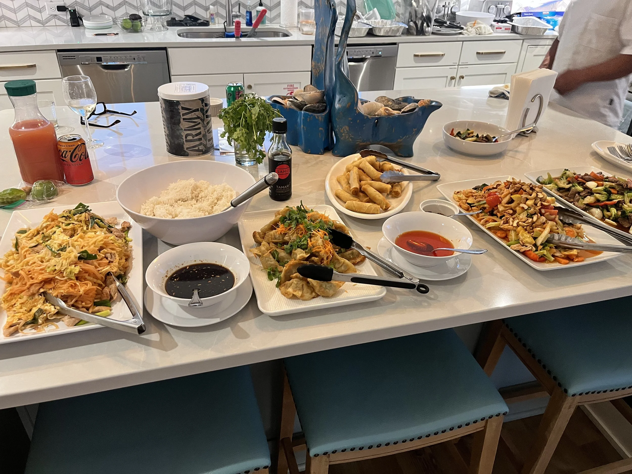 The meal that Chef Pok made us, which included spring rolls, dumplings, and pad thai. It was delicious!