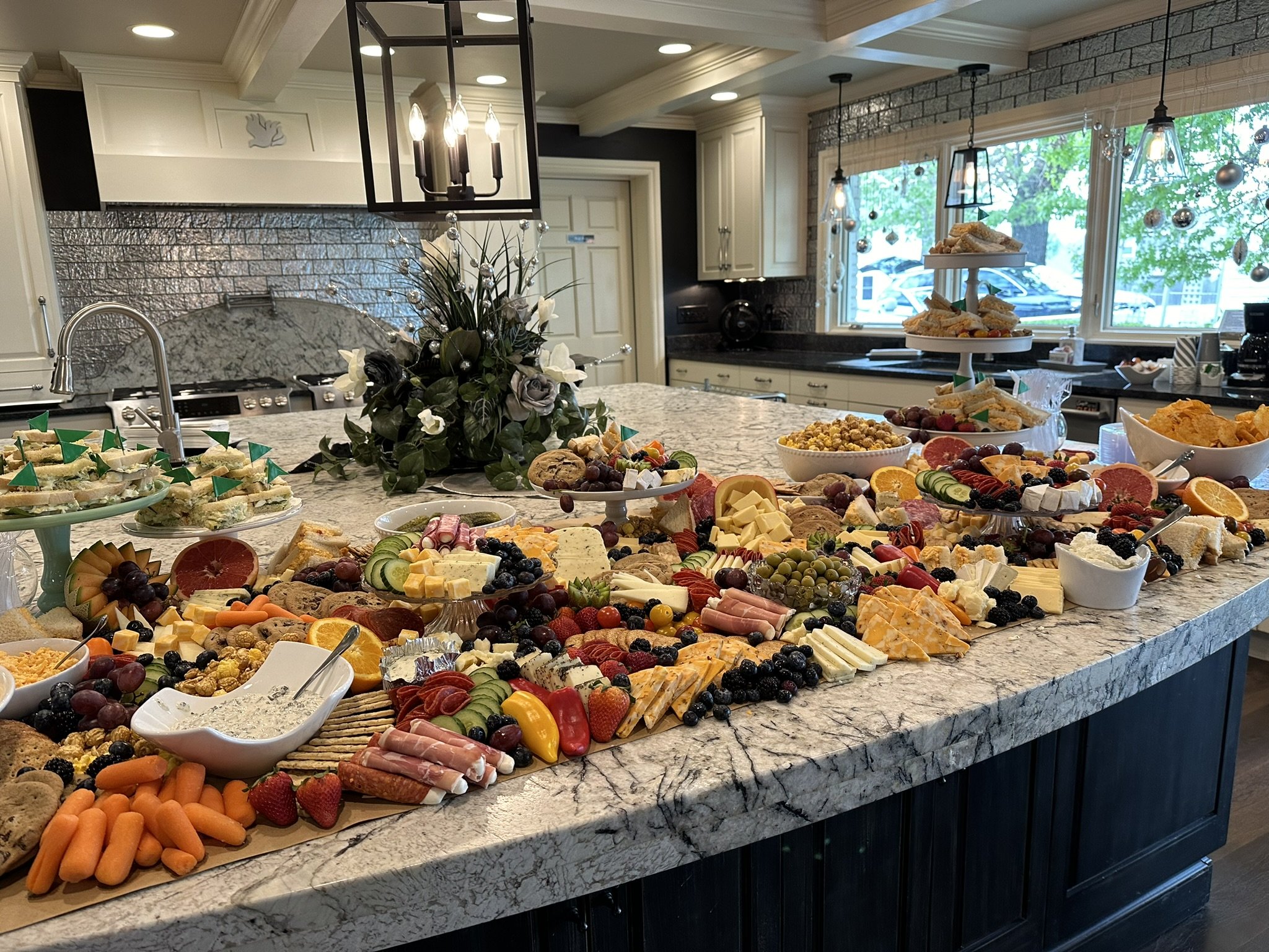 A fun Master's themed charcuterie board complete with pimento cheese/chicken salad sandwiches, cookies, and chips! A great event for Edward Jones-  Financial Advisor-  Brett Thompson at The Mansion at Terra Place ⛳️⛳️