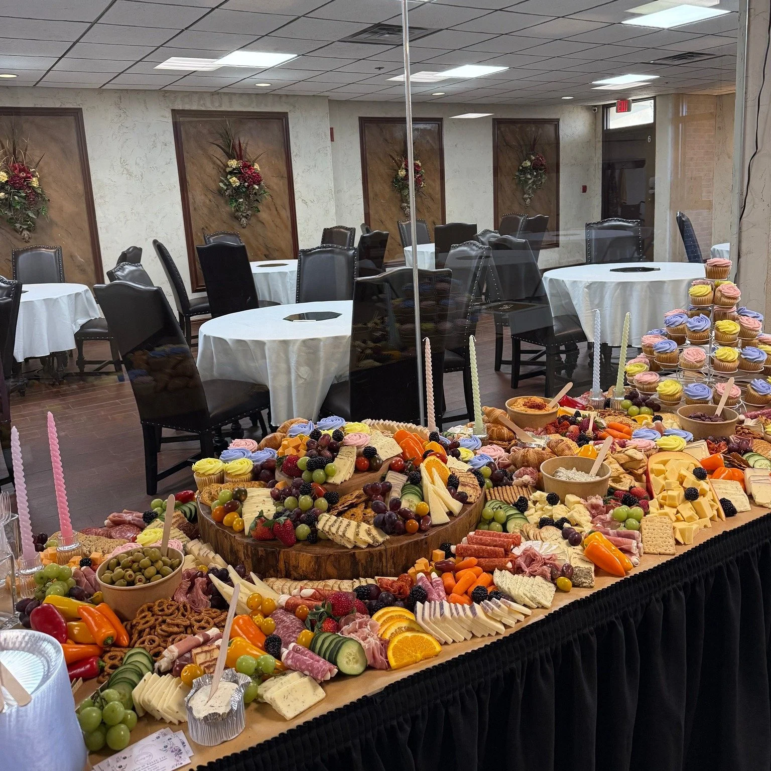 A Spring wedding spread that is colorful indeed! This client had us incorporate their cupcakes, candlesticks, and large wooden board. We can incorporate any serving ware into your spread free of charge!