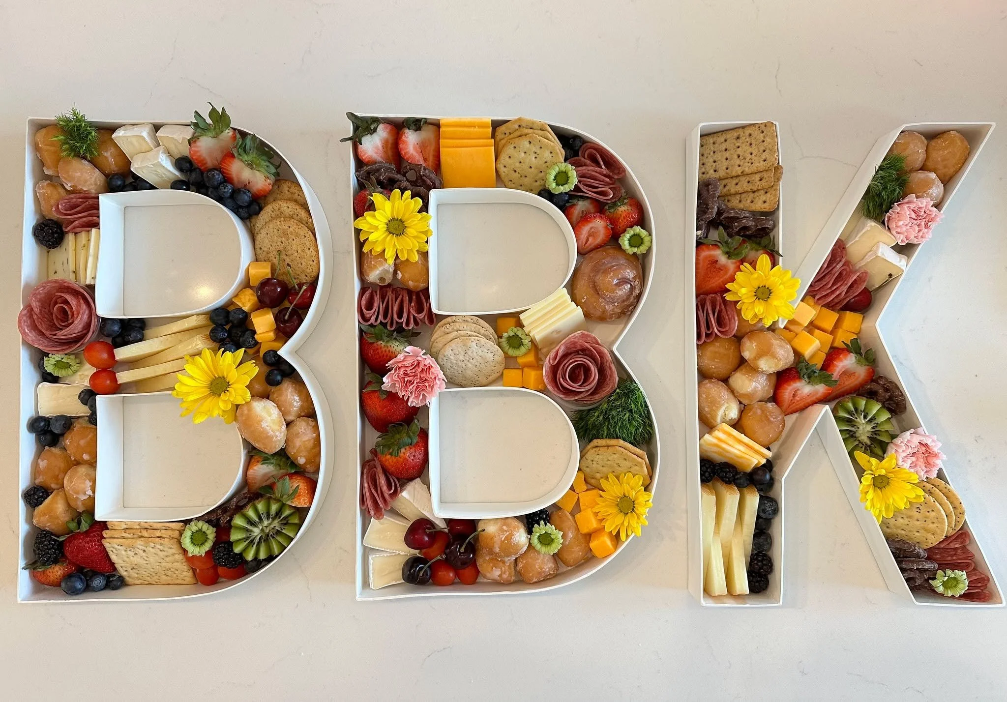 Throw back to our ribbon cutting 3 years ago and made these fun charcuterie letters!