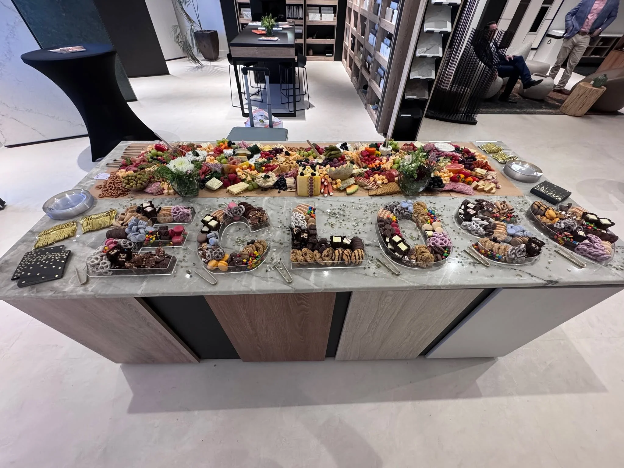 A beautiful board at a beautiful tile store here in OKC showcasing their new tile products. Check out some of our charcuterie foods on their tile!