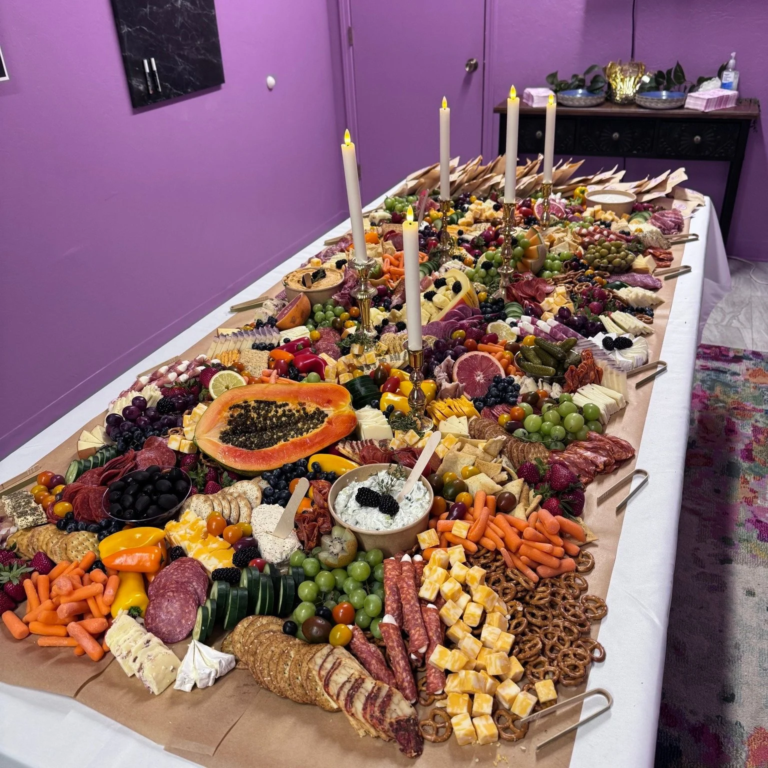 A wedding board at YAY on Broadway! Love the candlesticks incorporated into the board. We can incorporate any decor into your board free of charge!