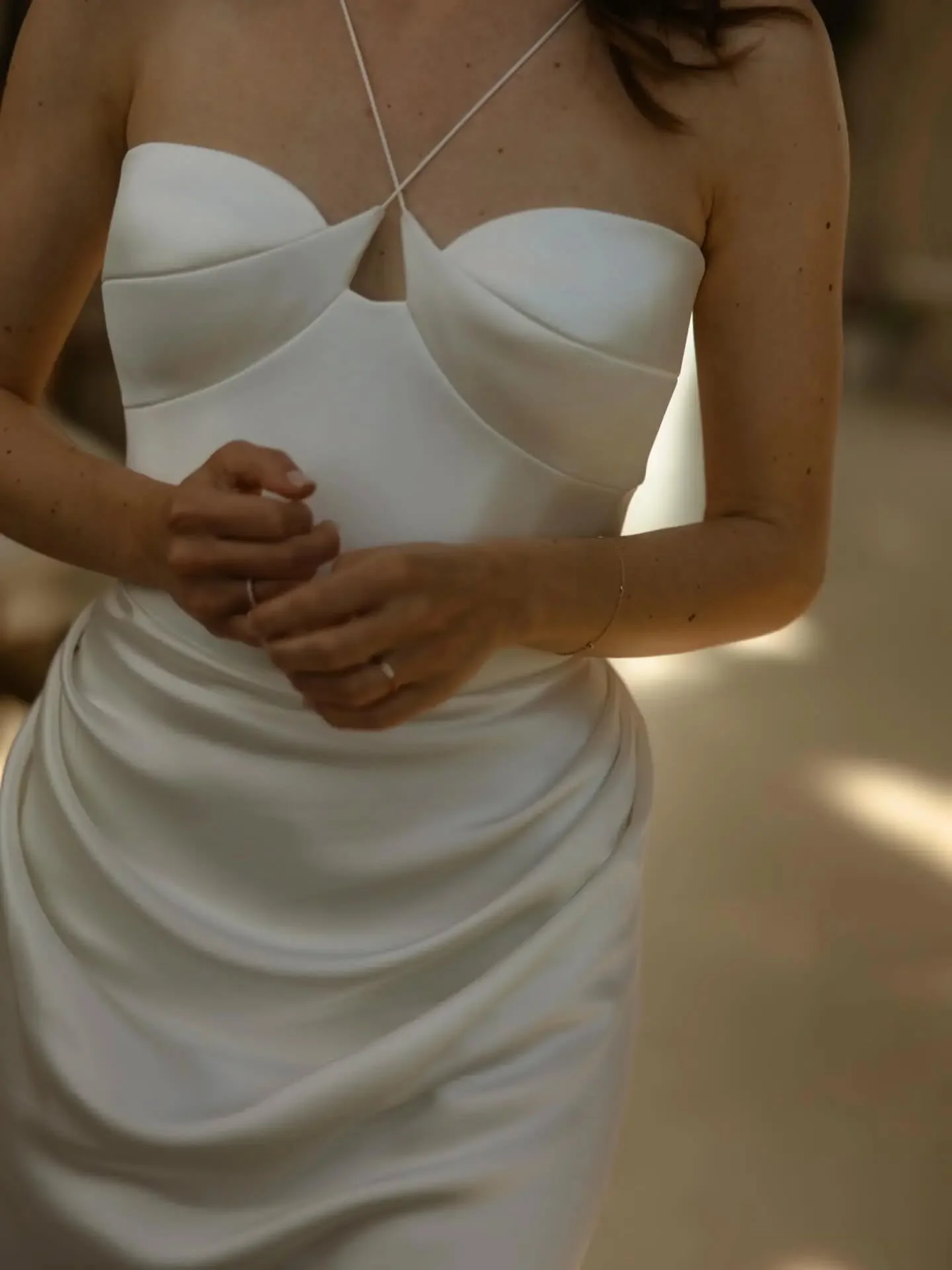 Golden hour, silk, and a dress that moves like this ✨

@divineatelier real bride in the Leya gown &mdash; effortlessly sculpted with its signature draped corset, delicate crossover straps and fluid silk silhouette.
Modern, understated, and impossibly