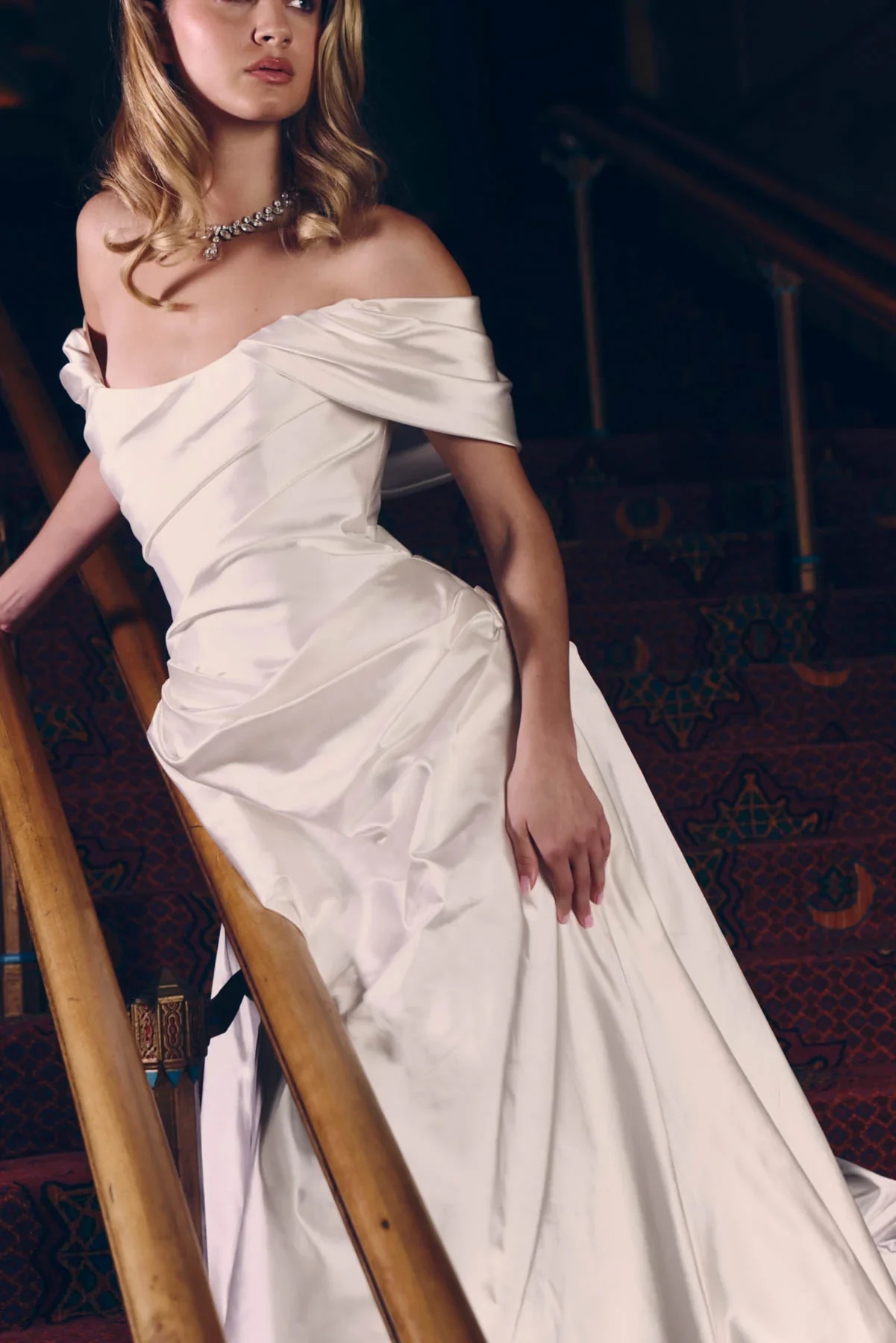 Renhue Chapter IX wedding gown featured for the Renhue Trunk Show at Everly Bridal. The gown showcases sculptural draping, a fitted silhouette, and luxurious satin inspired by Old Hollywood glamour.