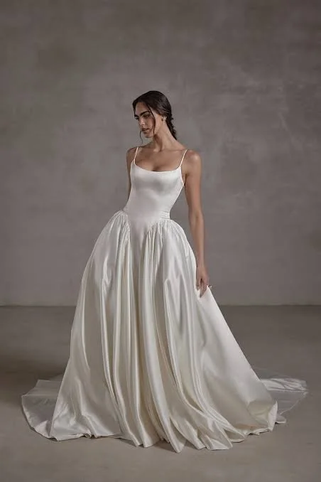 Elegant bride wearing a romantic Seraphine Bridal wedding gown featuring soft, modern details and an effortlessly feminine silhouette.