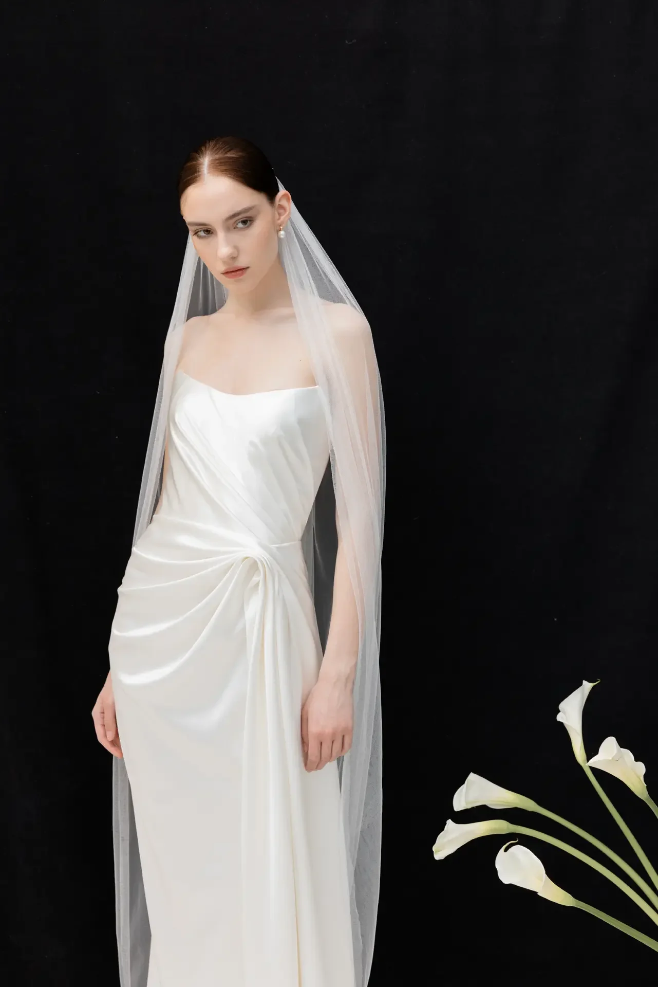   DIVINE ATELIER 
  Divine Atelier creates sophisticated, romantic wedding dresses that blend timeless elegance with minimalist design and bohemian inspiration. Co-led by Mara Cosleacara and her mother, Lumi, the brand celebrates individuality and cr