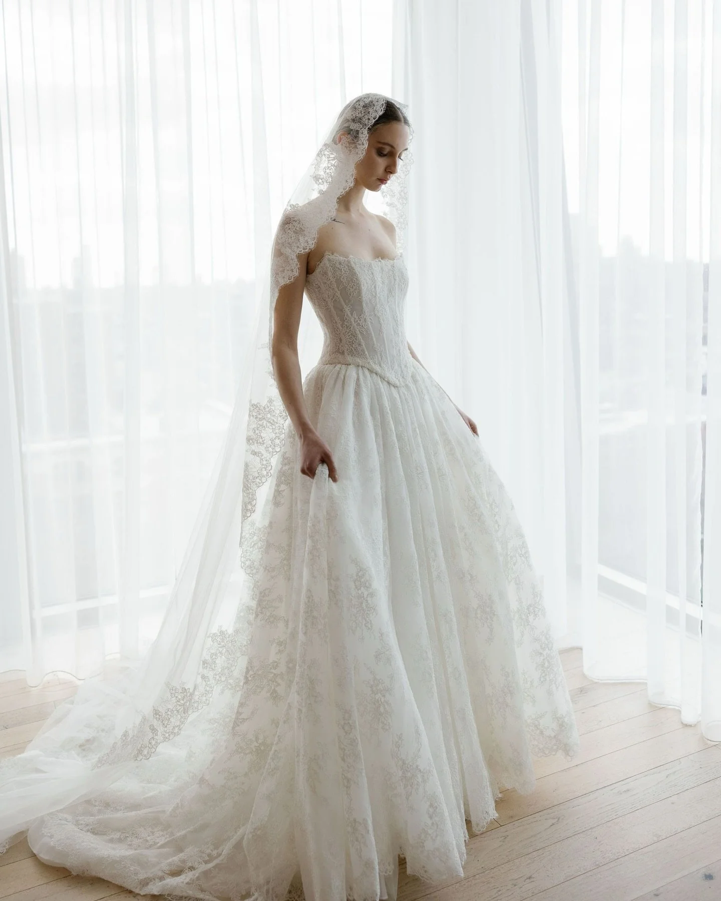lena Leena wedding gown featured for the Blossom Code Trunk Show at Everly Bridal. The gown showcases sculptural floral-inspired details, modern corsetry, and an elegant romantic silhouette.