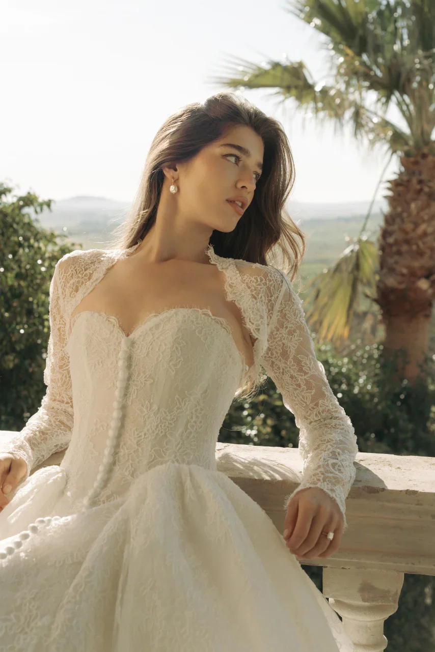 Made With Love Bridal's Rue wedding gown featured to promote the Solenne Trunk Show at Everly Bridal. The lace gown features a structured sweetheart bodice, delicate Chantilly lace, and a modern, romantic silhouette.