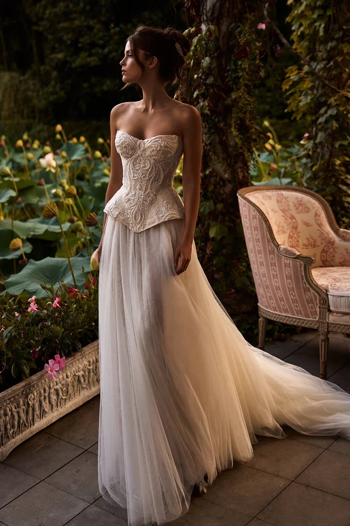  Milla Nova 
  Milla Nova creates luxurious, romantic wedding dresses defined by intricate lacework, exquisite beadwork, and feminine European elegance. 