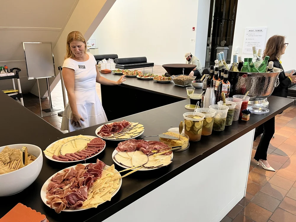 A table of Italian antipasti and cheeses at a Society cooking event