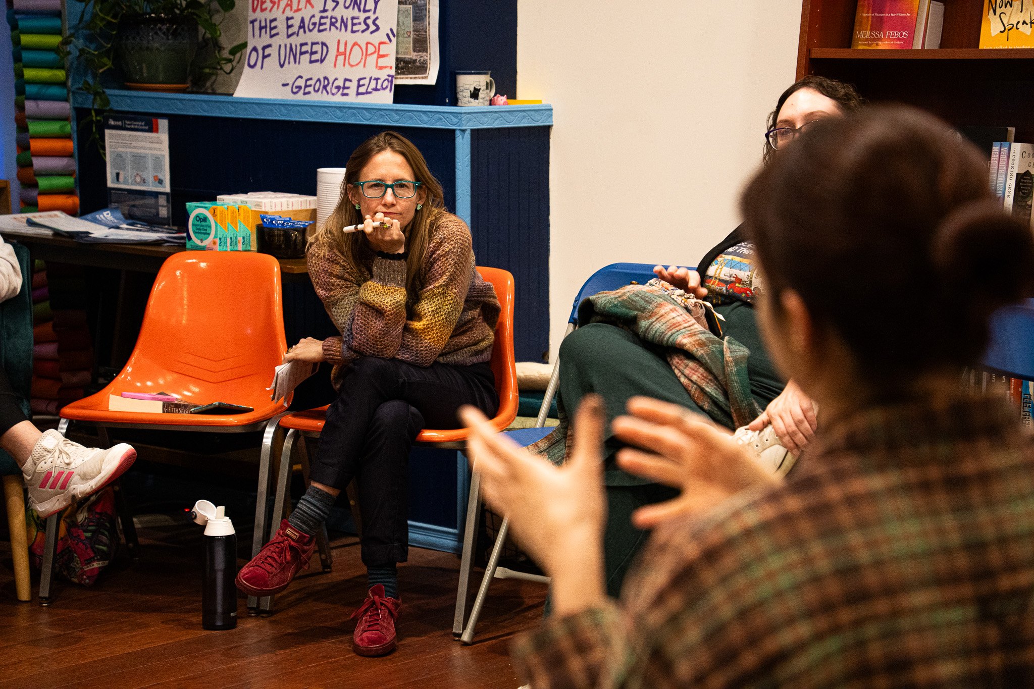 Elise Jajuga receiving an answer to her question about a member's book of choice in the November Book Club meeting on November 20th, 2025 in Lansing, Mich.