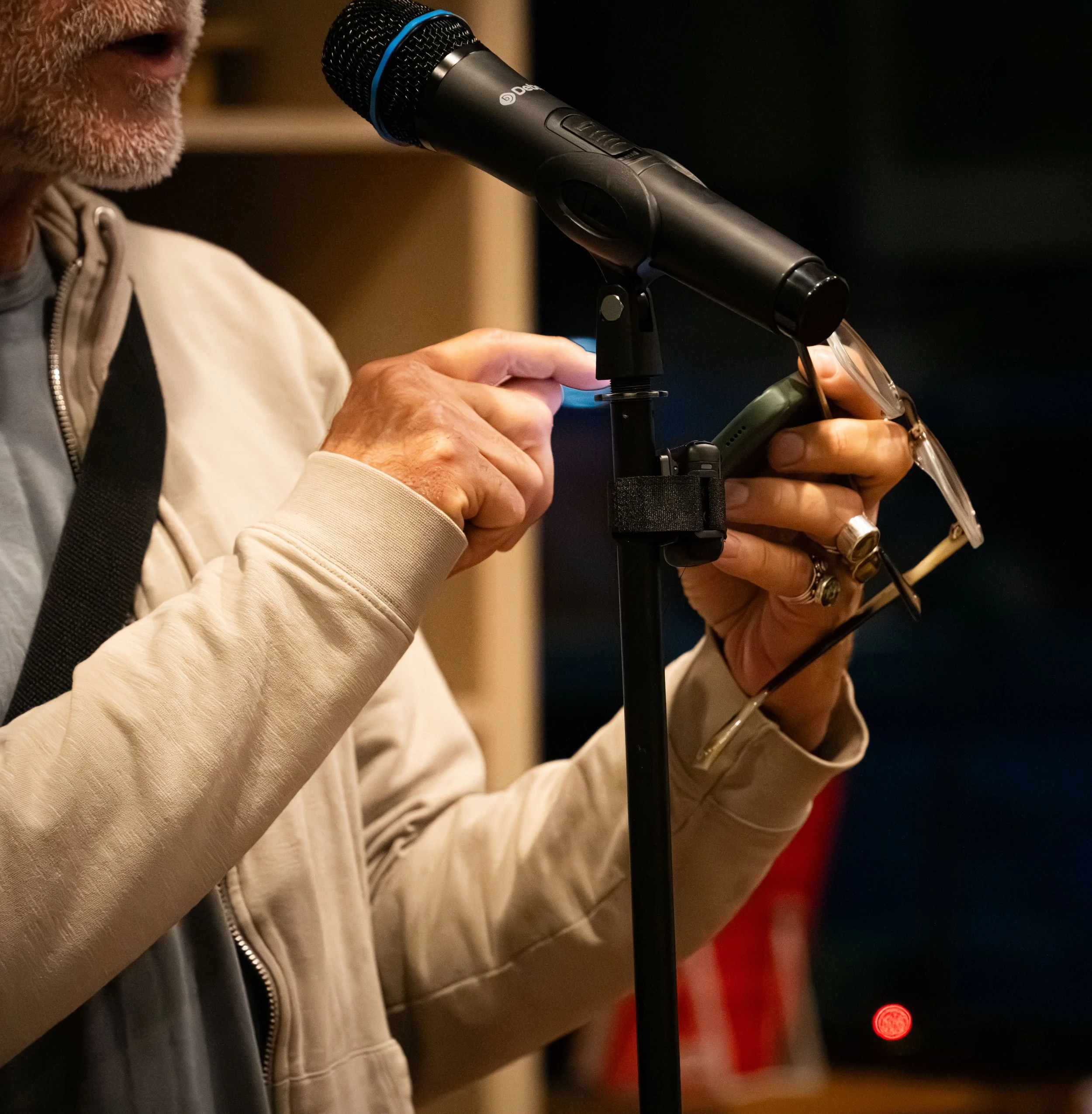 A warm hearted man who went up to the mic to read a poem off his phone at A Novel Concept's poetry slam with the Poetry Room on September 19th, 2025 in Lansing, Mich.