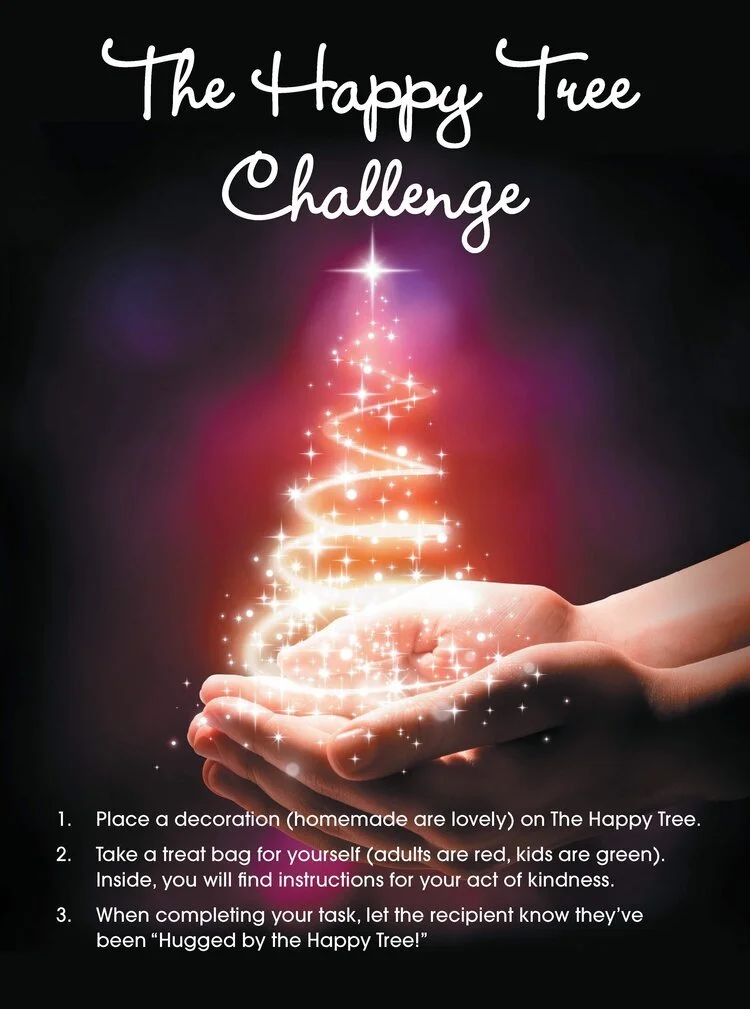 "The Happy Tree Challenge" text above hands holding a glowing Christmas tree with sparkles. Instructions: 1. Place a decoration on The Happy Tree. 2. Take a treat bag with instructions for an act of kindness. 3. Inform recipient of being "hugged by the Happy Tree."