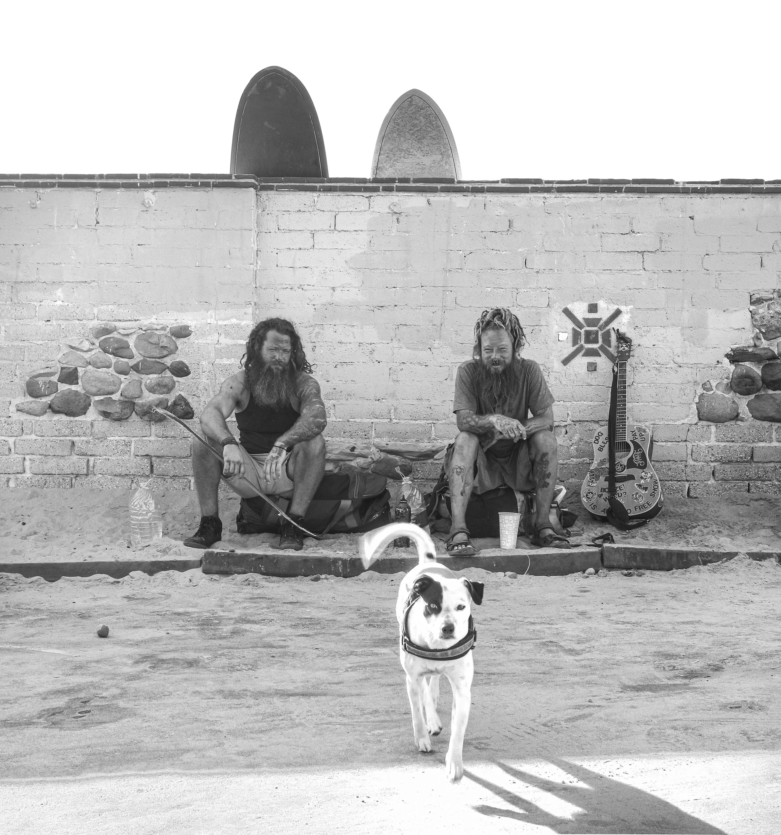 Malibu wall, two guys and a dog.jpg