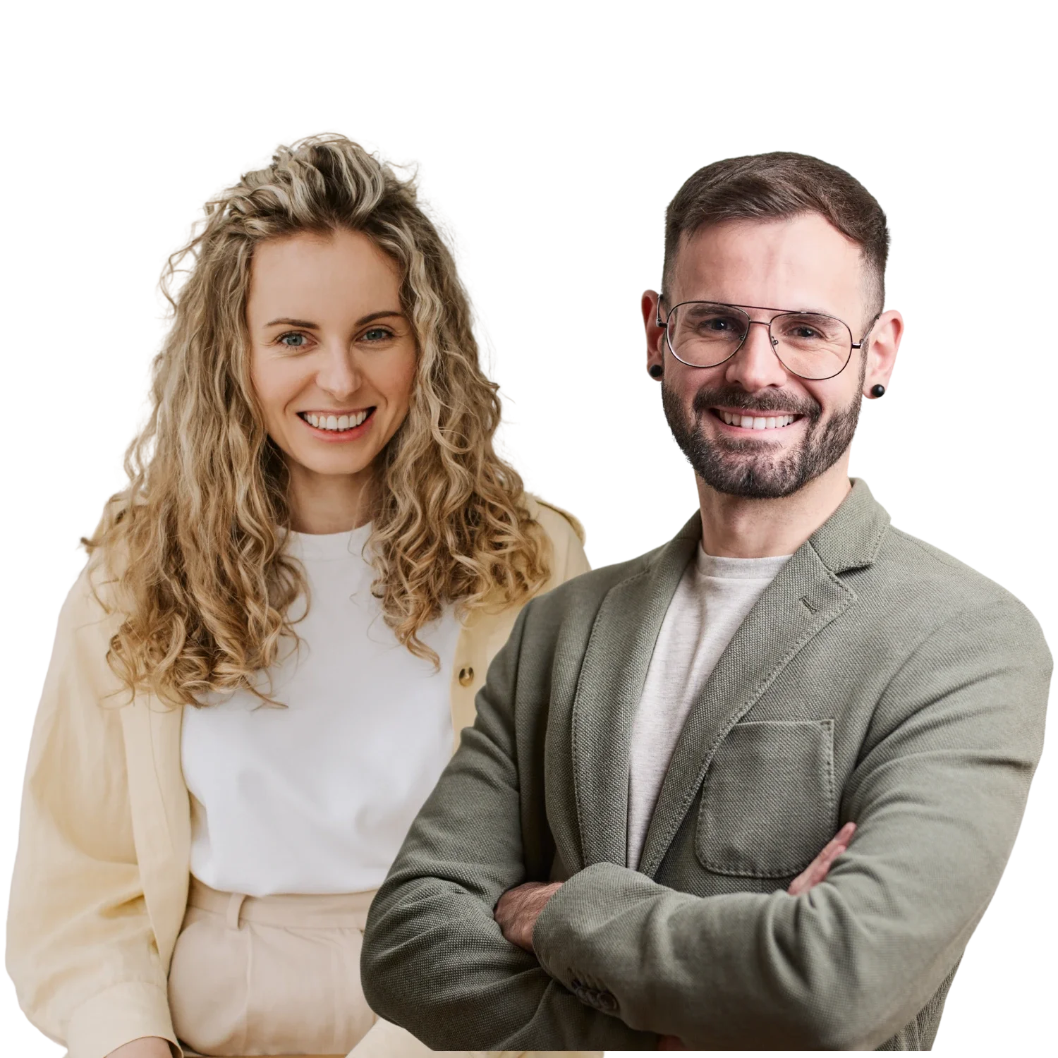 A smiling woman with curly blonde hair and a smiling man with glasses, a beard, and short brown hair, standing with arms crossed, both dressed in casual professional attire.