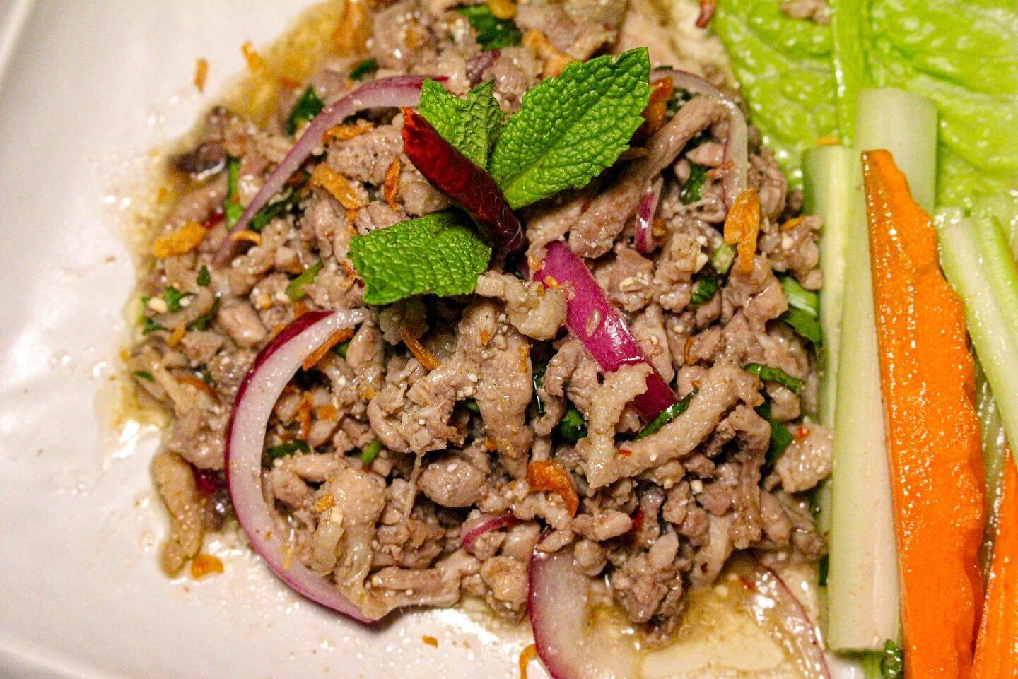 Presenting Laab Duck (duck salad); a part of our special seasonal menu ❄️. 

This delectable dish is flavored with fish sauce, lime juice, crushed red chilies, and toasted ground rice. 🦆

.
.
.
.
.
.
.

#bmorefood #fellspoint #baltimore #thaifood #t