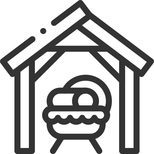 A black and white icon of the manger to represent Christmastide.