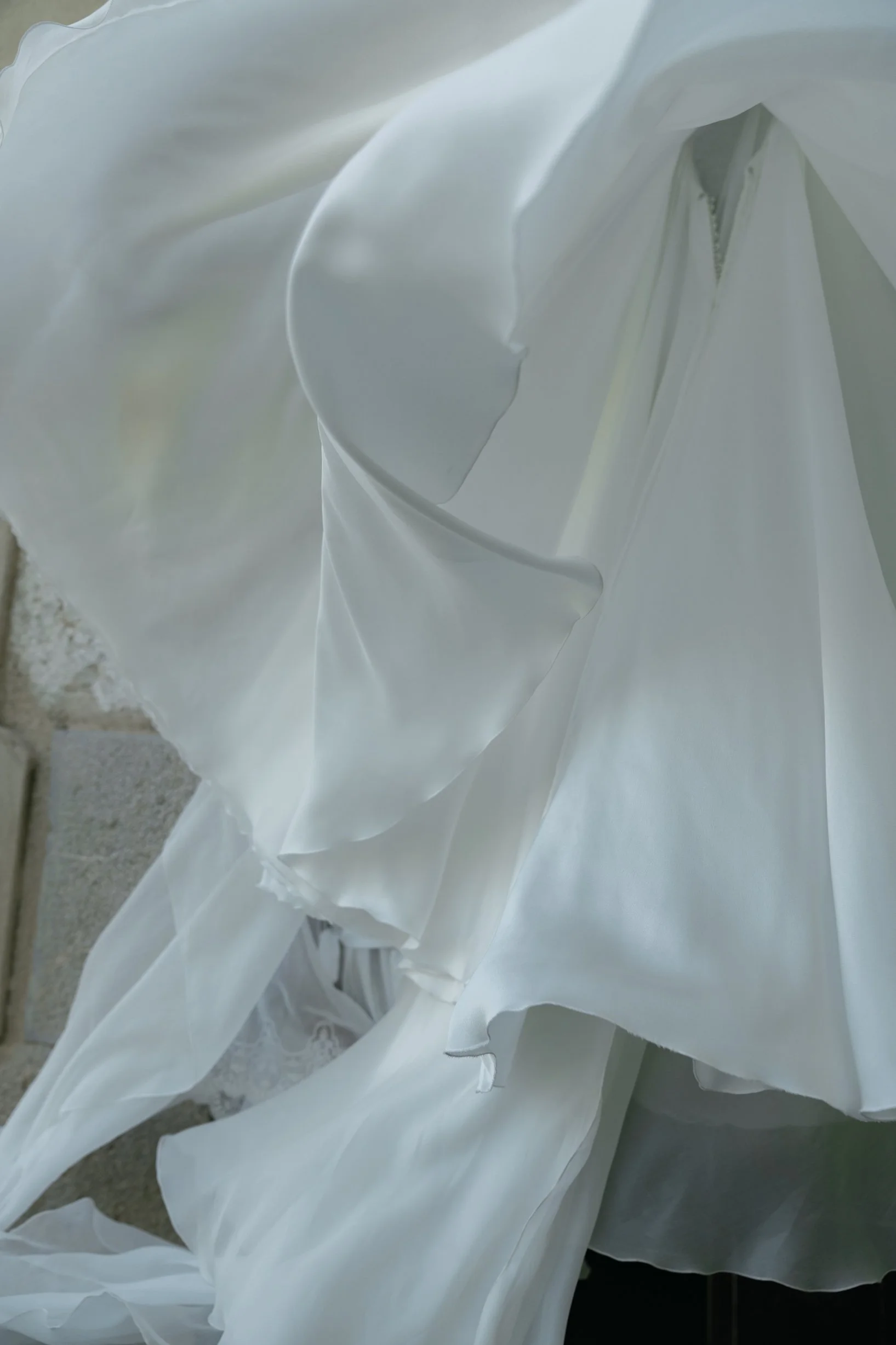 Close-up of white plastic or fabric material with folds and wrinkles.