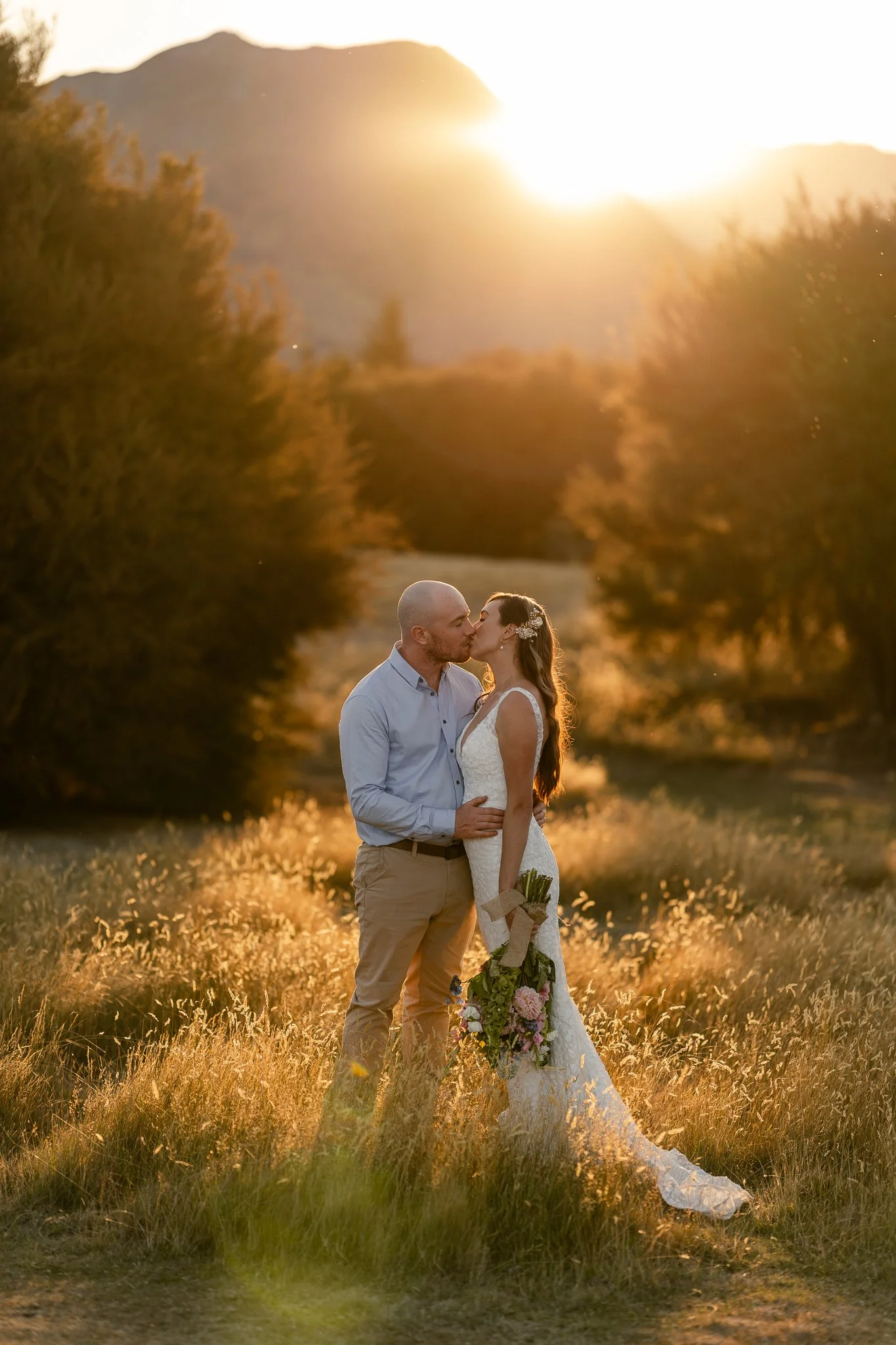 Couple kissing at sunset