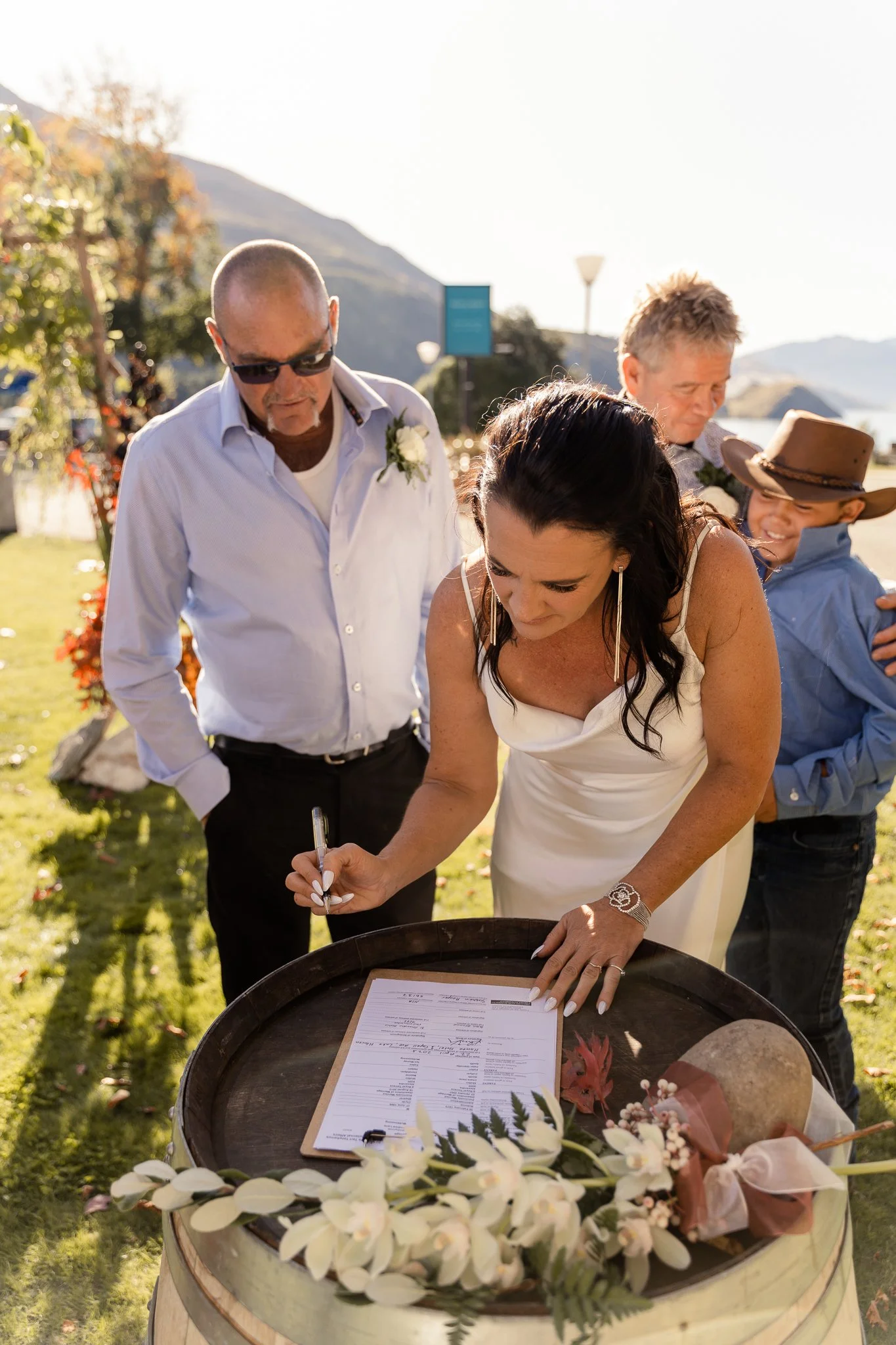 A bride signing wedding paperwork. 