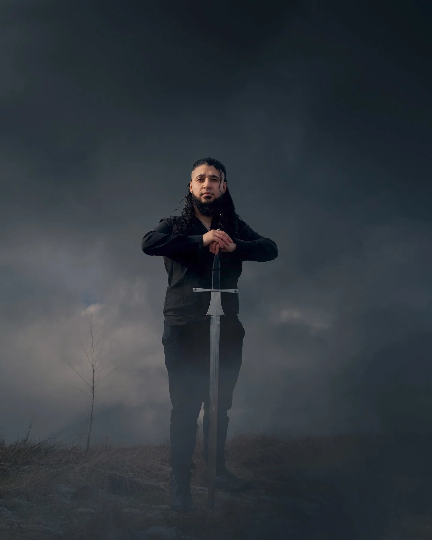 Some shoots feel less like photography and more like stepping into a story. I wanted to create an image that felt like a moment pulled straight from a fantasy saga. A lone warrior standing calm before the storm, blade grounded, waiting for whatever e