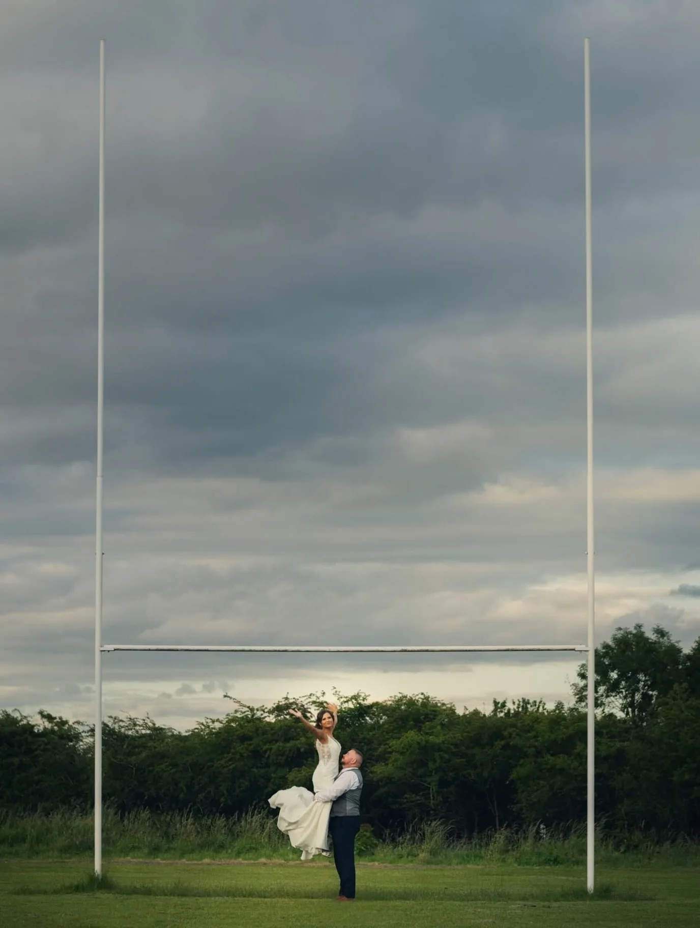 Just the two of them, a rugby pitch, and a moment worth remembering 🏉

#ajtimages #alternativeweddingphotographer #coventrywelshrugbyclub #warwickshireweddingphotographer
