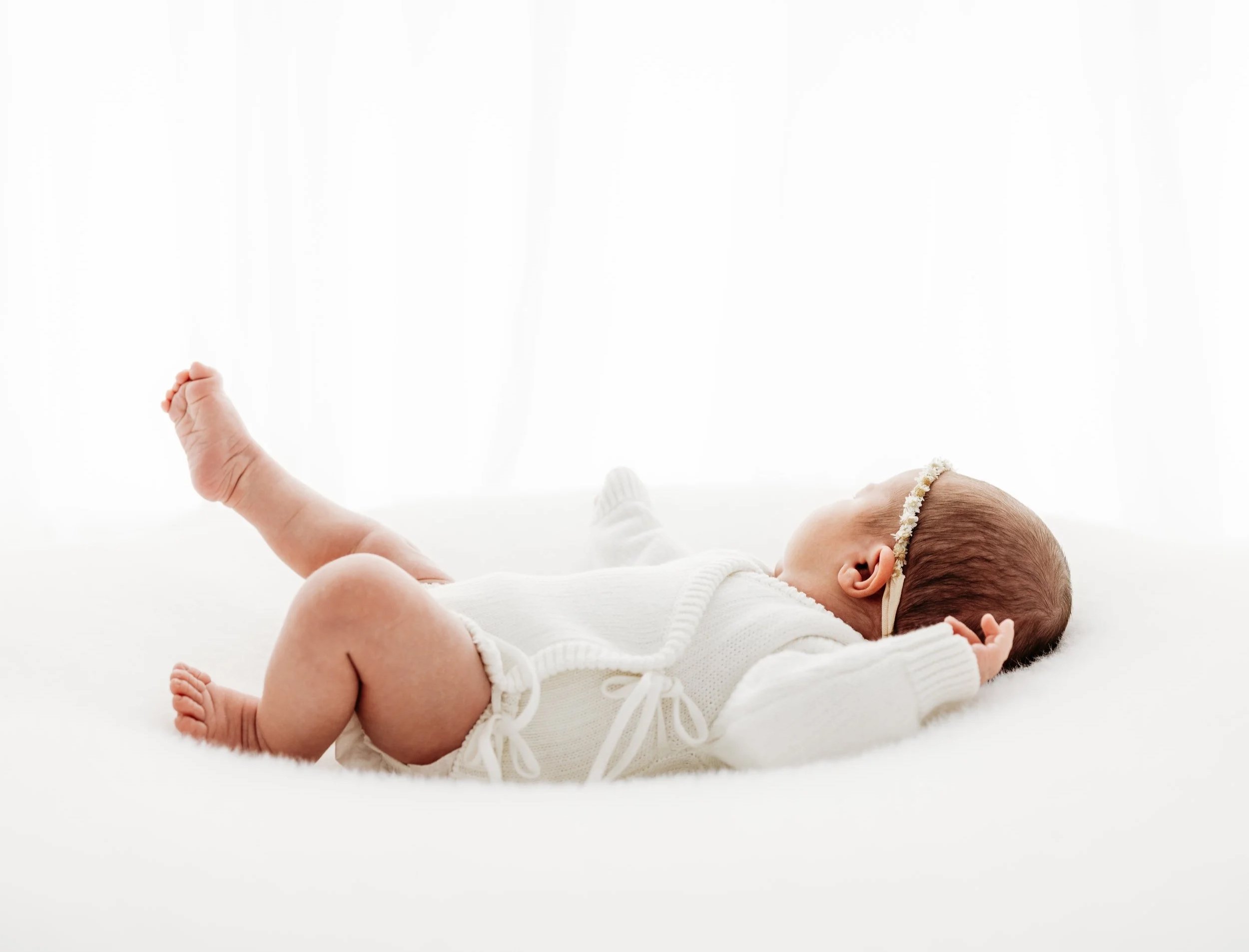 Newborn baby resting naturally during a gentle, baby-led photography session in Perth.