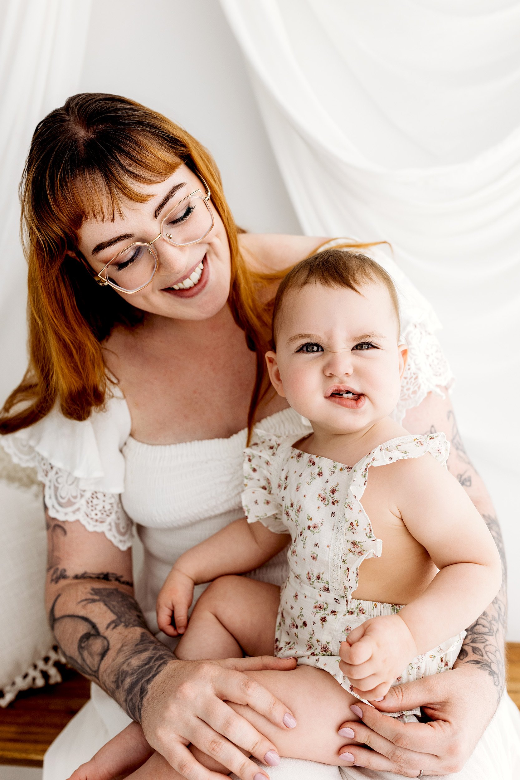 Mum laughing with her baby during their Motherhood Mini Session