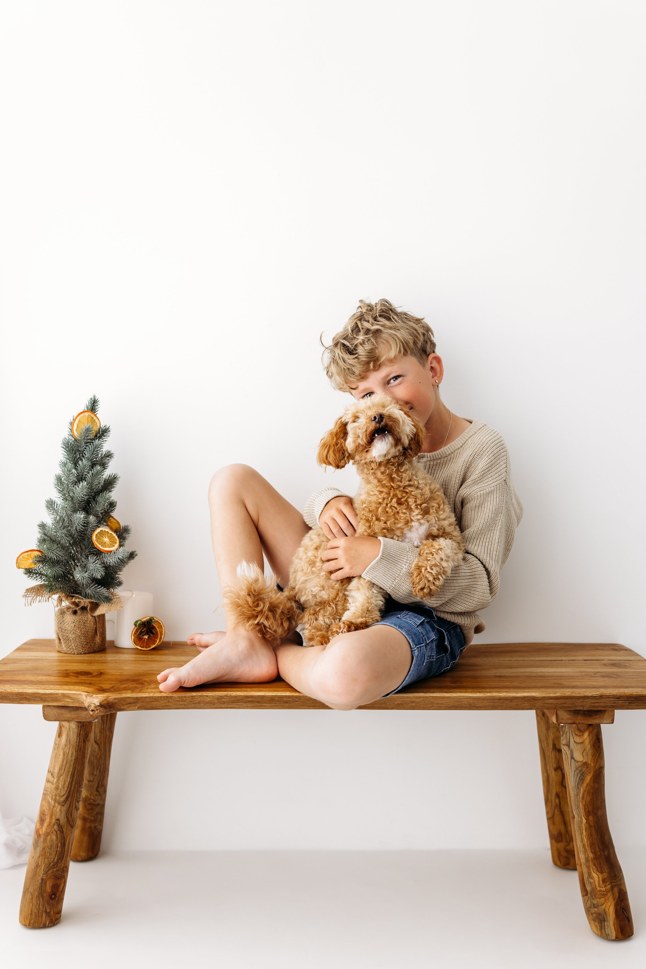 Christmas family photography in a warm, nostalgic studio setting in Perth