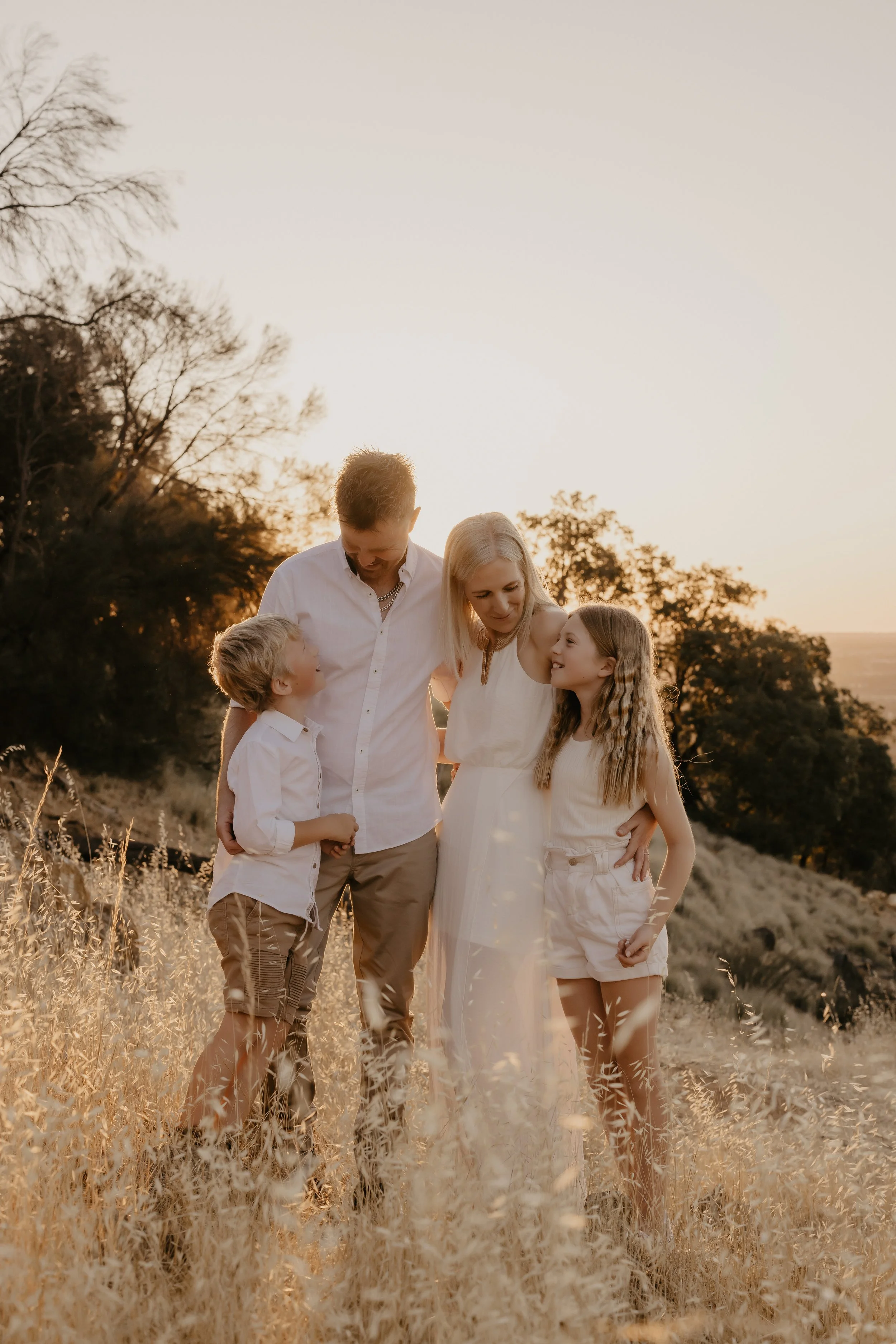 Christeen with her husband and children during a family photography session in Perth