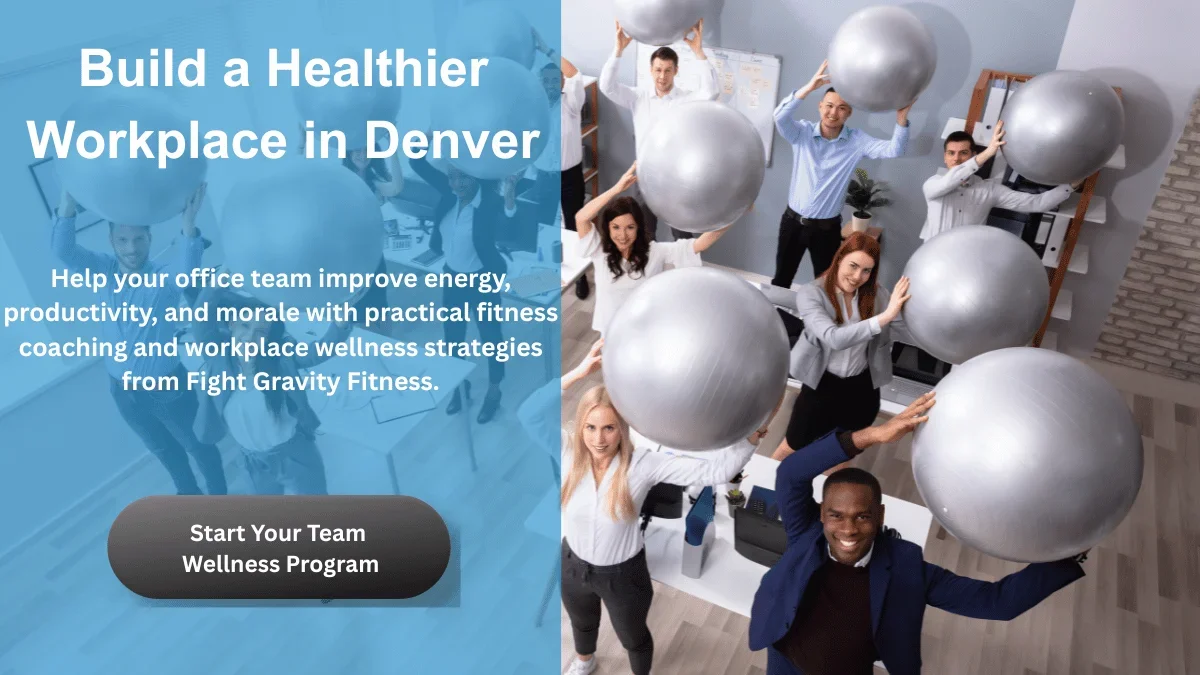 Office employees holding exercise stability balls while promoting a workplace wellness program in Denver focused on improving energy, productivity, and team morale through fitness coaching.