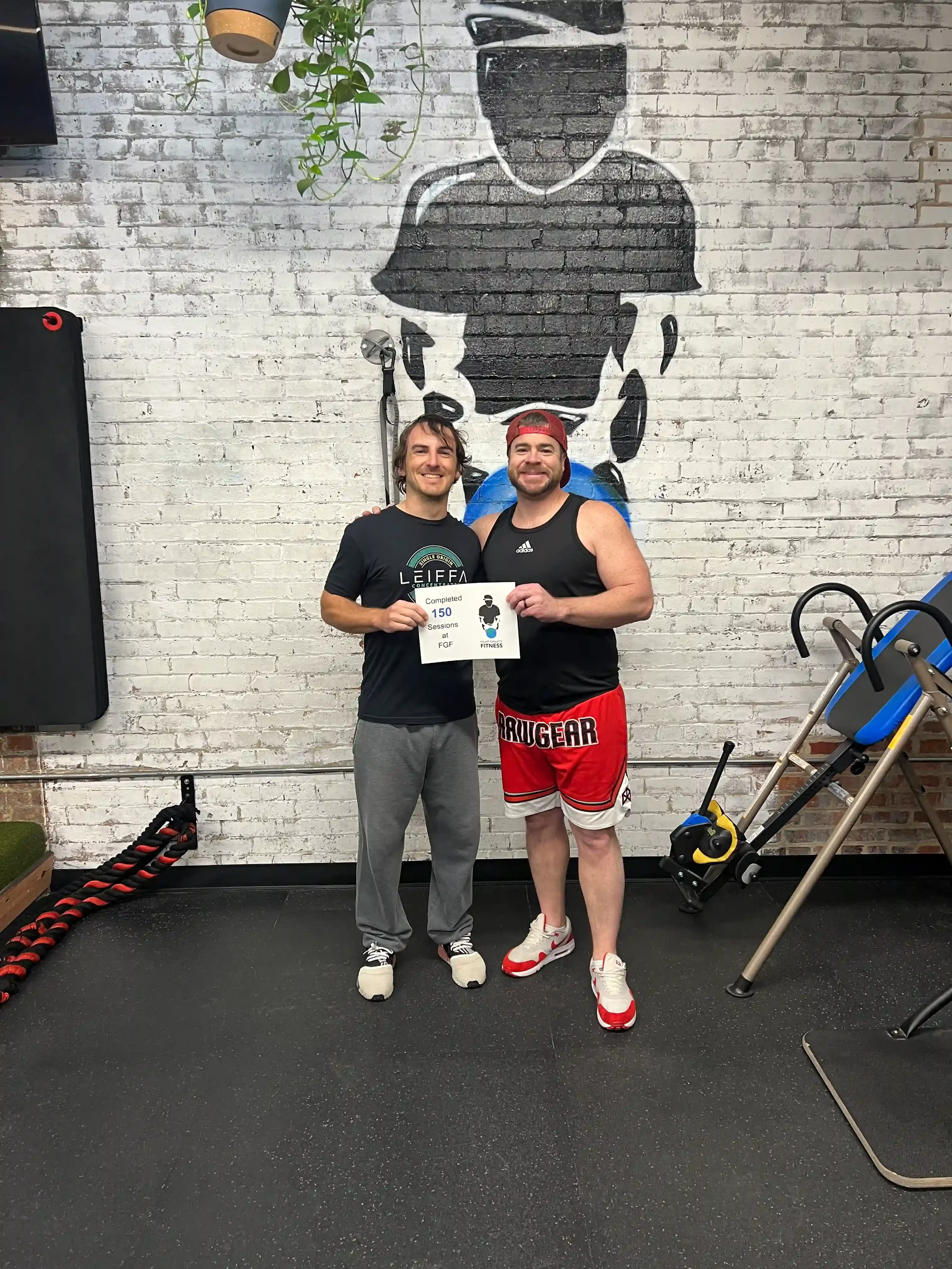 Nick Butler with Client celebrating 100 sessions