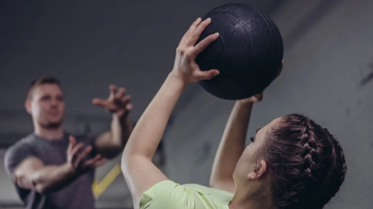 Trainer with Athlete Improving Performance